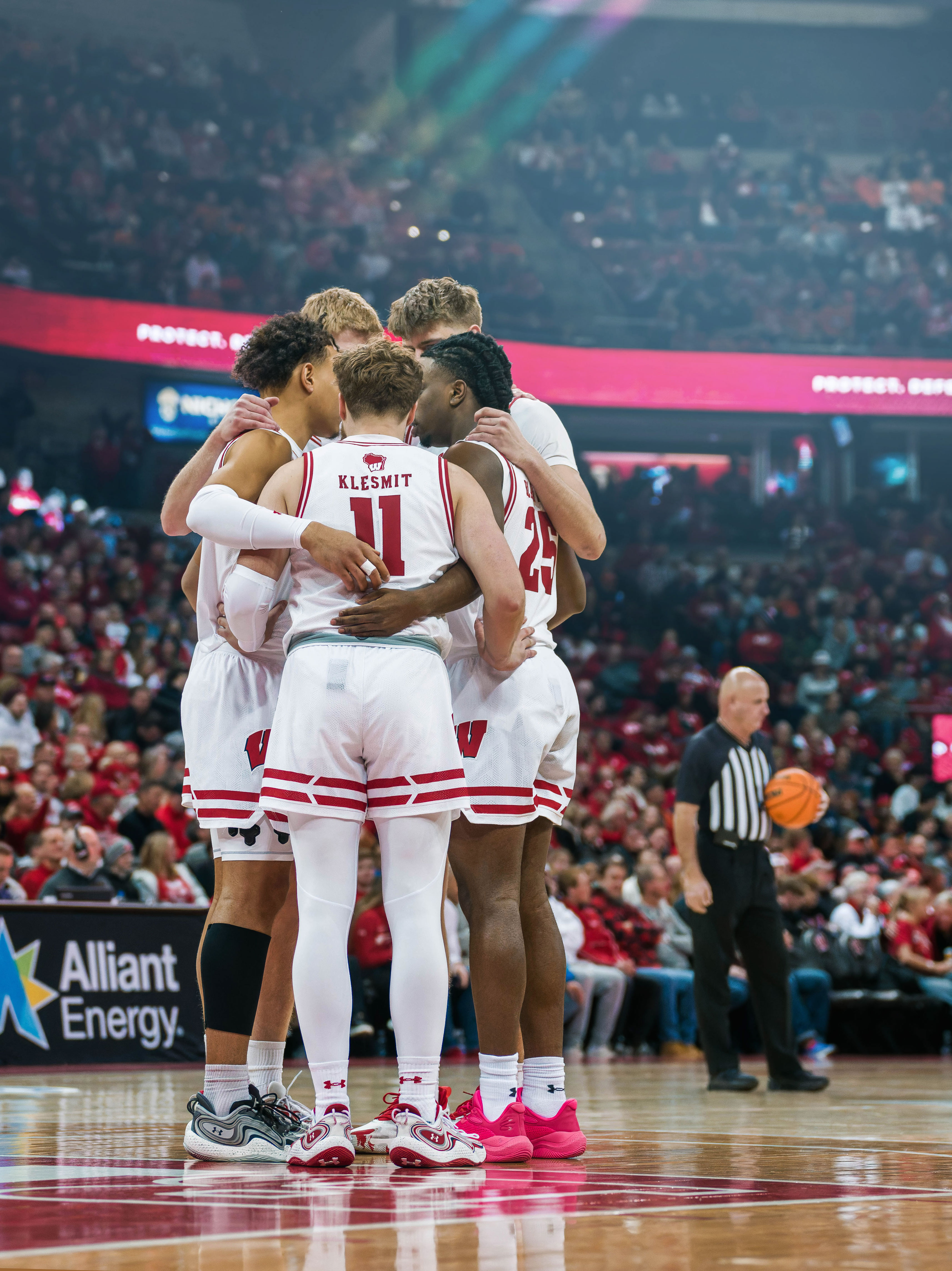 The Wisconsin Badgers starting five converse before taking on the Illinois Fighting Illini at The Kohl Center on February 18, 2025 in Madison, Wisconsin. Photography by Ross Harried for Second Crop Sports.