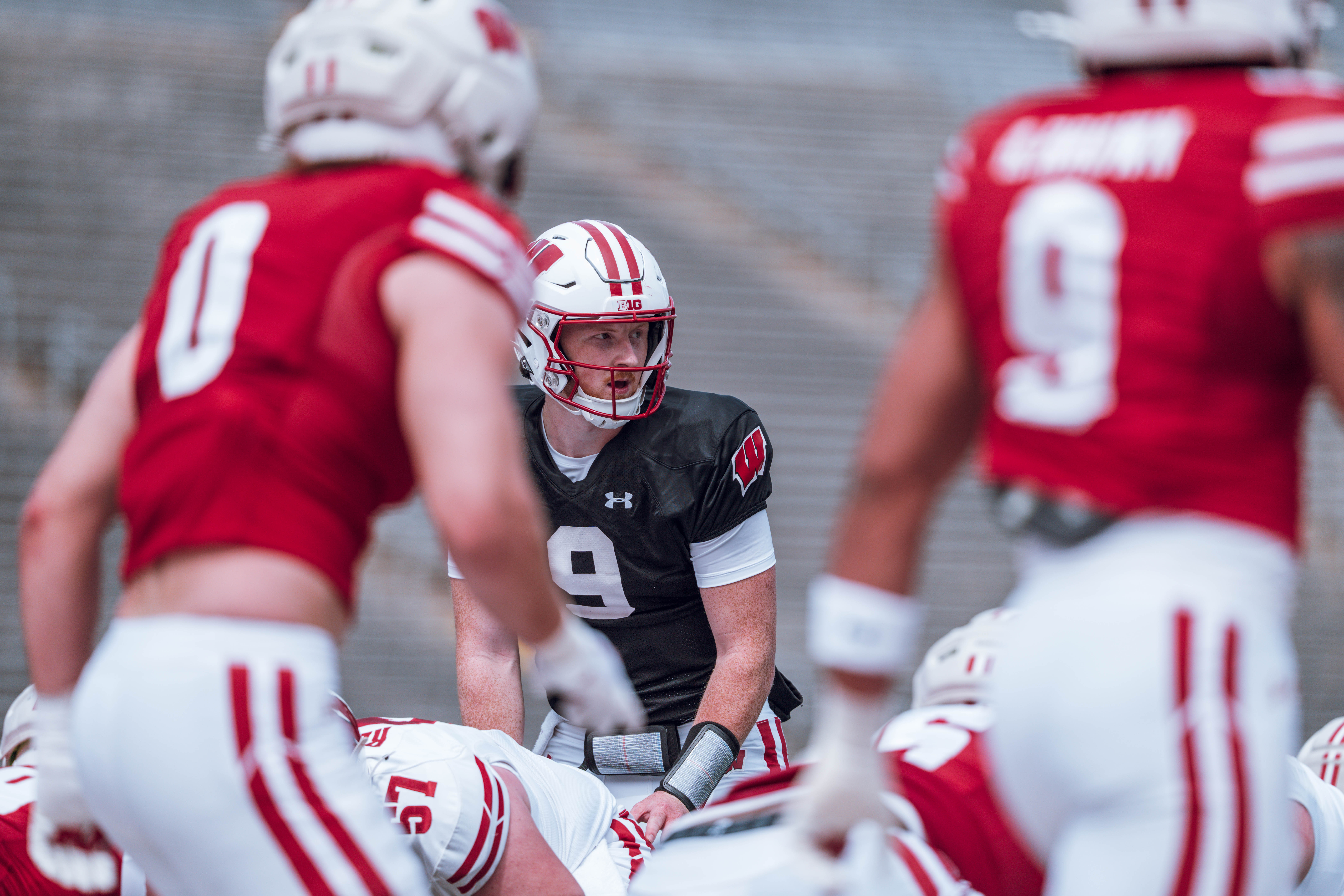 Wisconsin Badgers quarterback Billy Edwards Jr. #9 looks down the line of scrimmage during the Wisconsin Football Spring Showcase at Camp Randall Stadium on April 19, 2025 in Madison, Wisconsin. Photography by Ross Harried for Second Crop Sports.