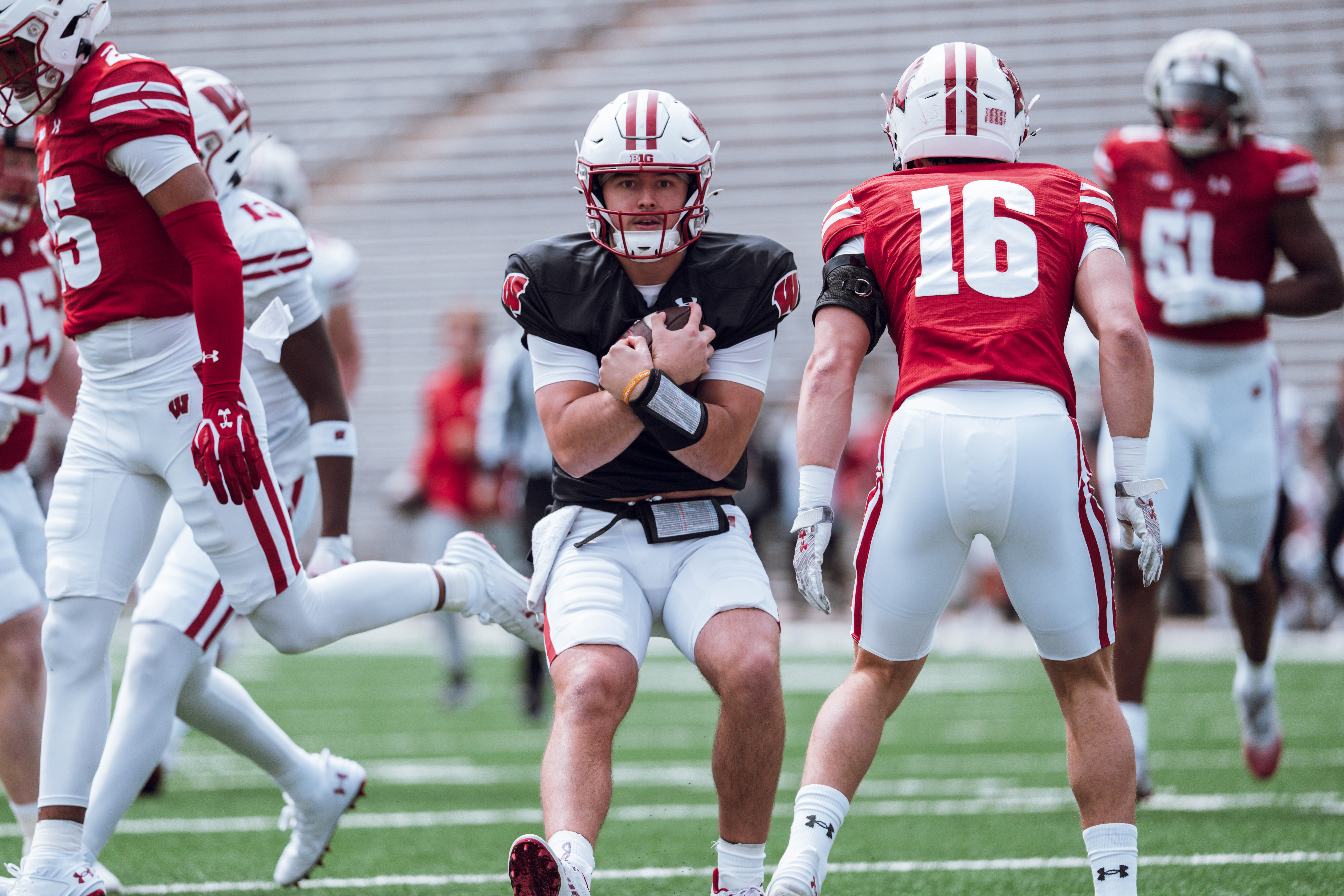 Wisconsin Badgers quarterback Danny O'Neil #18 protects the ball during at run at the Wisconsin Football Spring Showcase at Camp Randall Stadium on April 19, 2025 in Madison, Wisconsin. Photography by Ross Harried for Second Crop Sports.