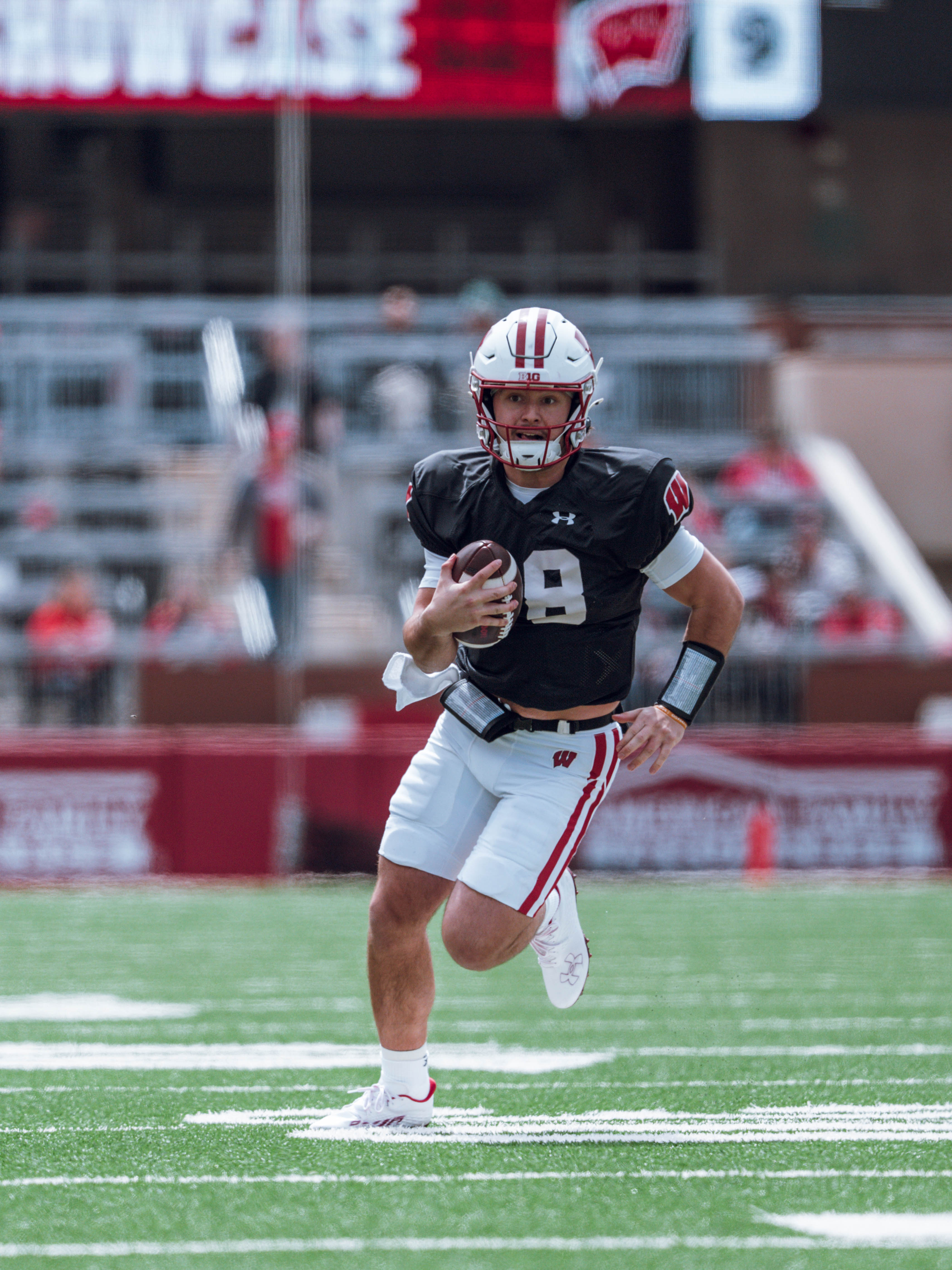 Wisconsin Badgers quarterback Danny O'Neil #18 runs the ball during the Wisconsin Football Spring Showcase at Camp Randall Stadium on April 19, 2025 in Madison, Wisconsin. Photography by Ross Harried for Second Crop Sports.