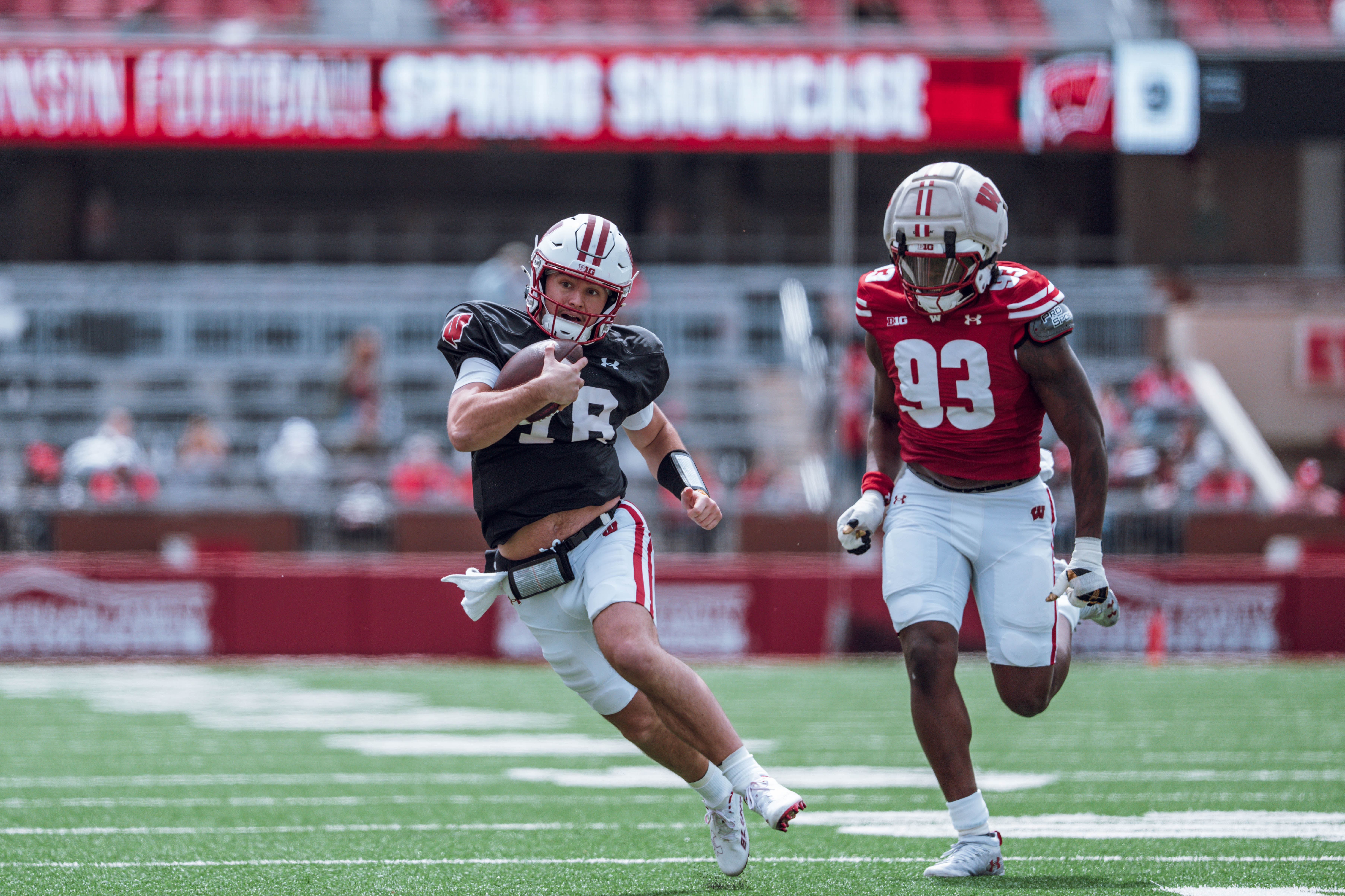 Wisconsin Badgers quarterback Danny O'Neil #18 runs the ball during the Wisconsin Football Spring Showcase at Camp Randall Stadium on April 19, 2025 in Madison, Wisconsin. Photography by Ross Harried for Second Crop Sports.