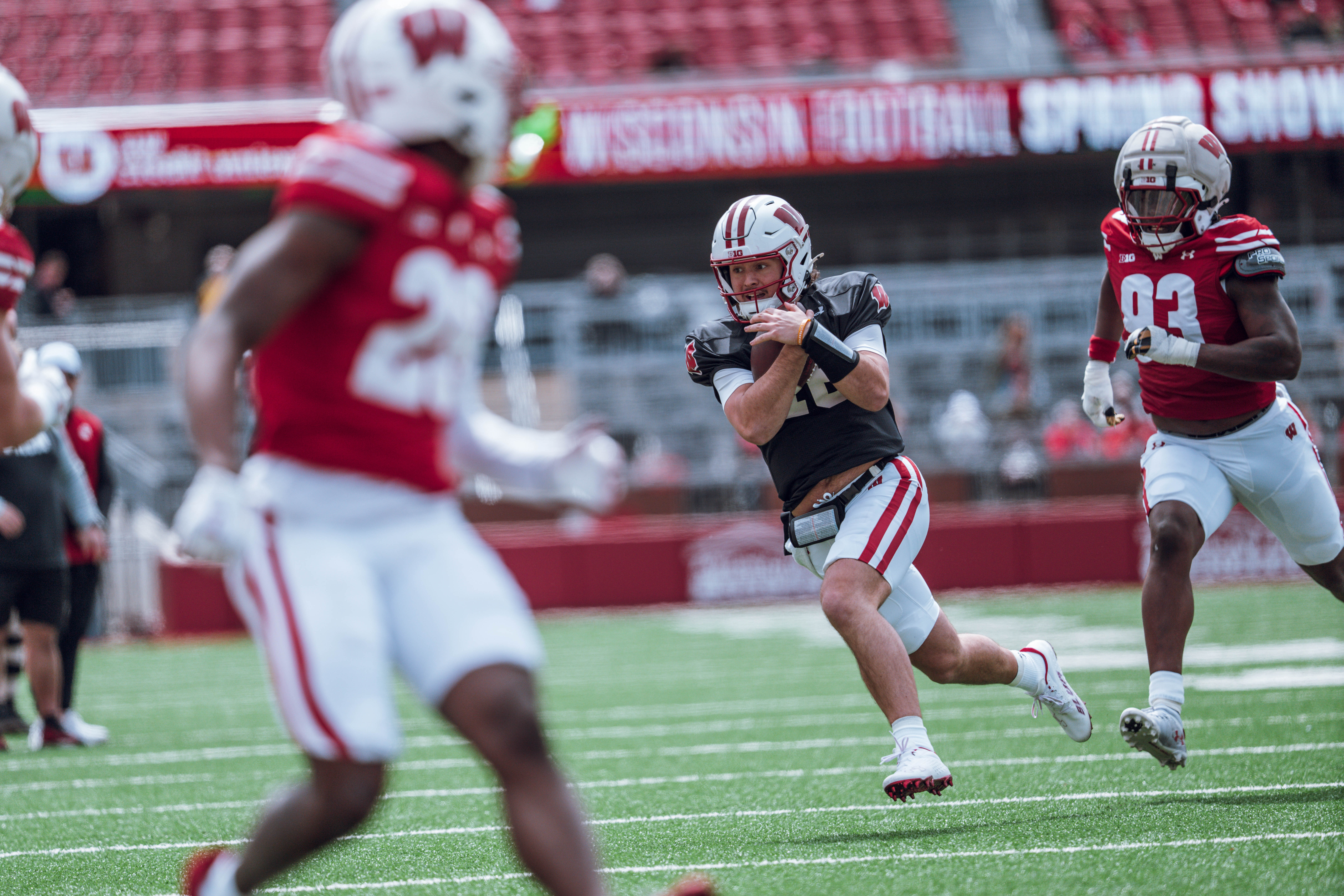 Wisconsin Badgers quarterback Danny O'Neil #18 runs the ball during the Wisconsin Football Spring Showcase at Camp Randall Stadium on April 19, 2025 in Madison, Wisconsin. Photography by Ross Harried for Second Crop Sports.
