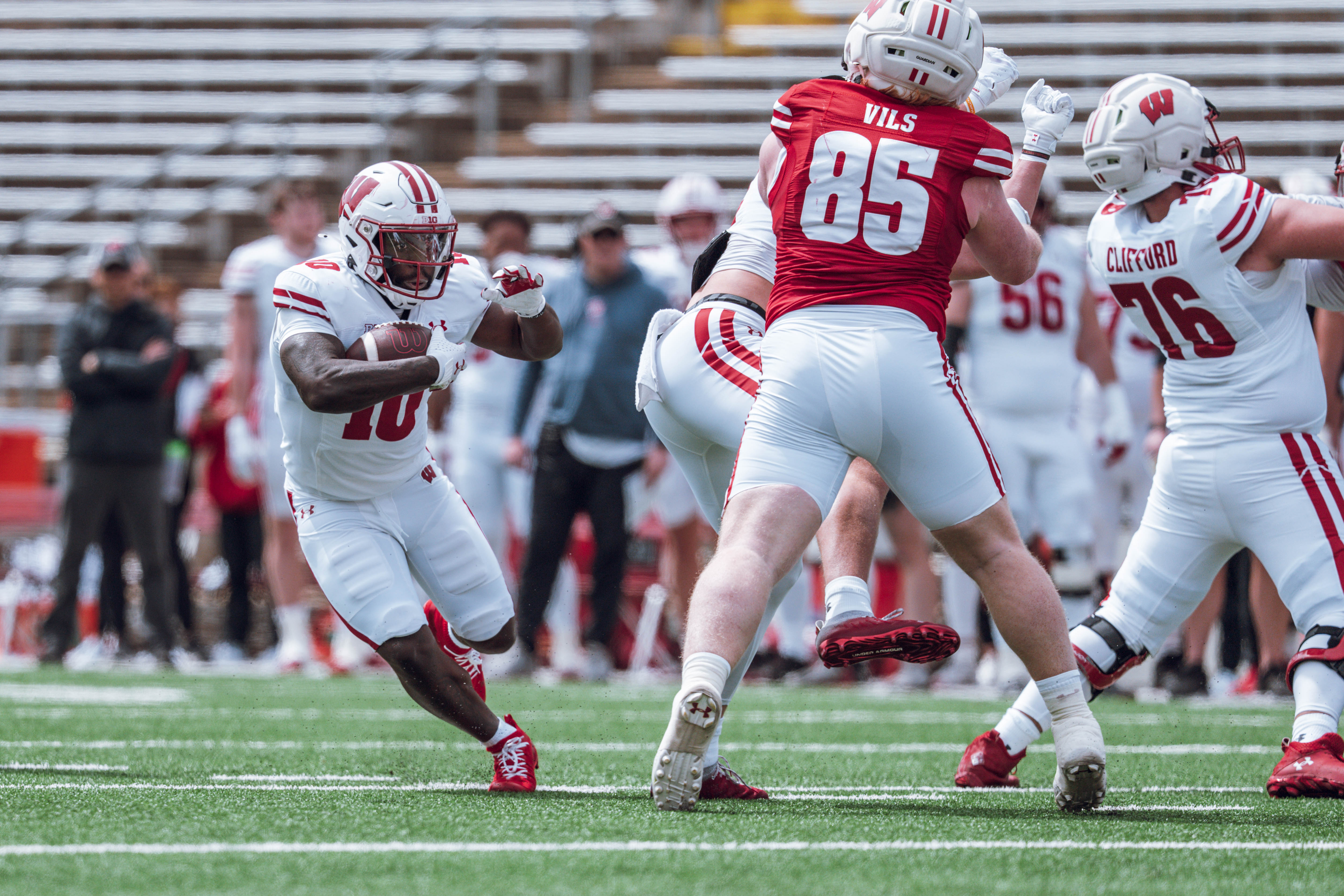 Wisconsin Badgers running back Gideon Ituka #10 makes a cut back at the line of scrimmage during the Wisconsin Football Spring Showcase at Camp Randall Stadium on April 19, 2025 in Madison, Wisconsin. Photography by Ross Harried for Second Crop Sports.