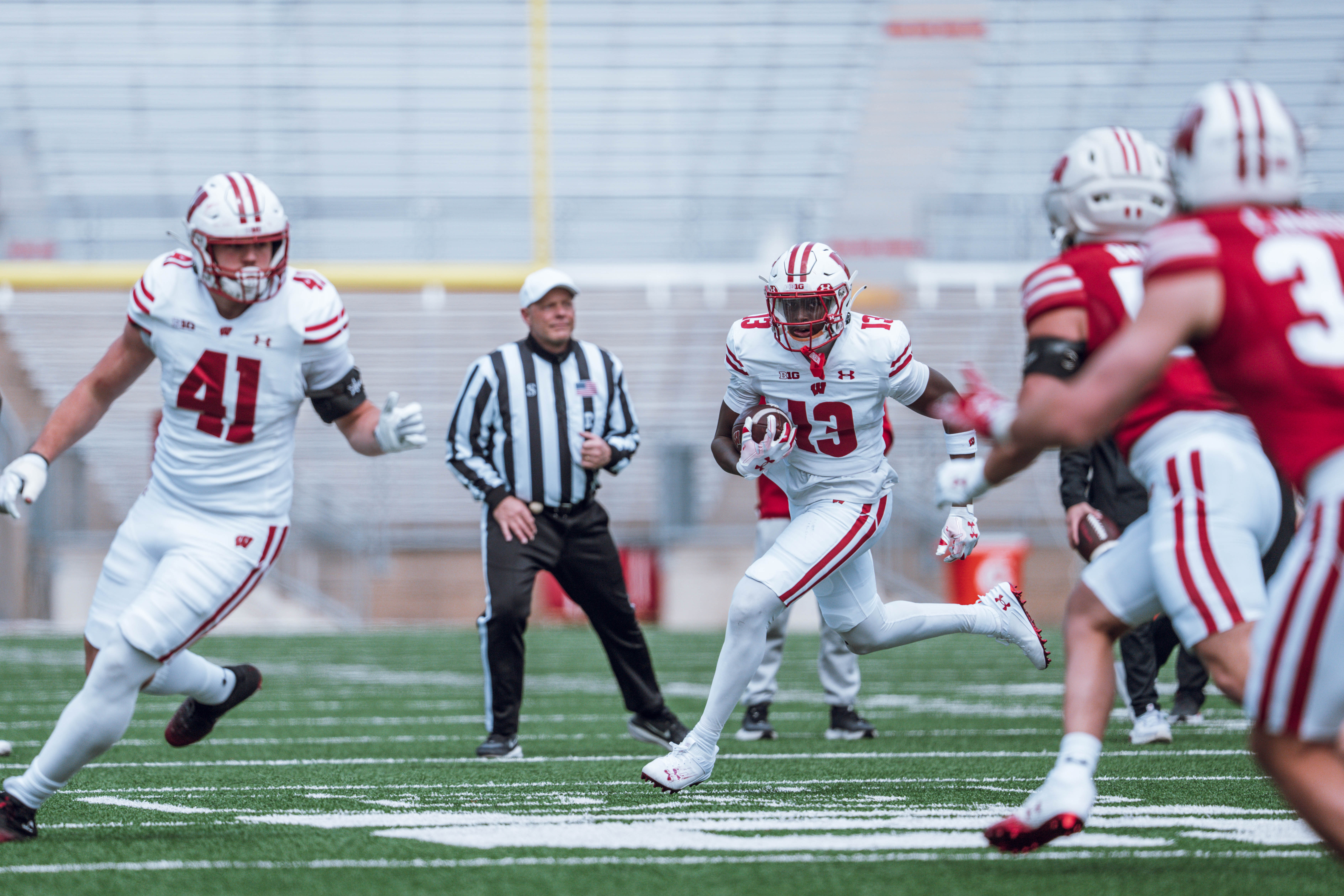 Wisconsin Badgers wide receiver Eugene Hilton Jr. #13 takes the end around during the Wisconsin Football Spring Showcase at Camp Randall Stadium on April 19, 2025 in Madison, Wisconsin. Photography by Ross Harried for Second Crop Sports.