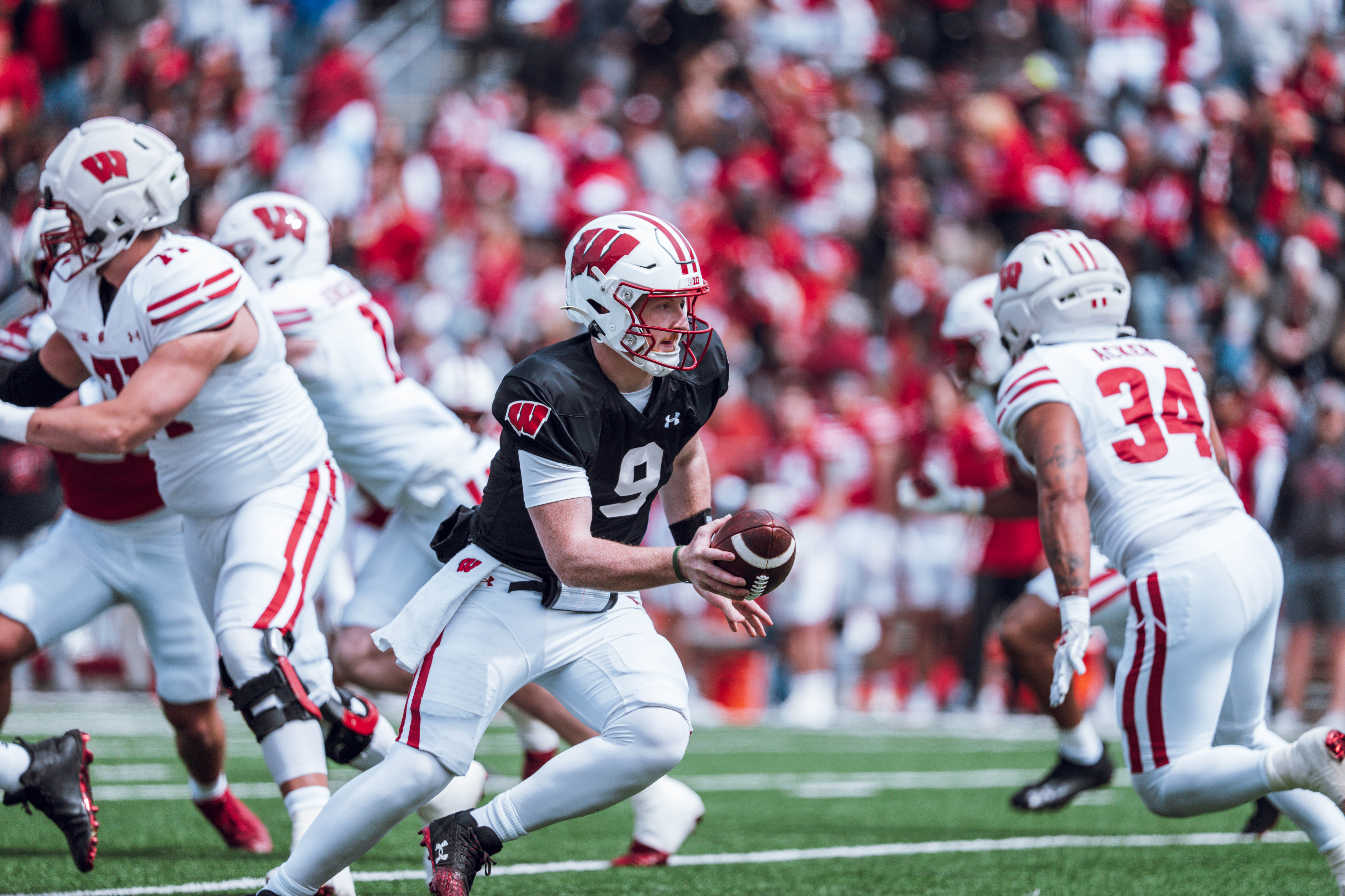 Wisconsin Badgers quarterback Billy Edwards Jr. #9 falls back to hand off the ball during the Wisconsin Football Spring Showcase at Camp Randall Stadium on April 19, 2025 in Madison, Wisconsin. Photography by Ross Harried for Second Crop Sports.