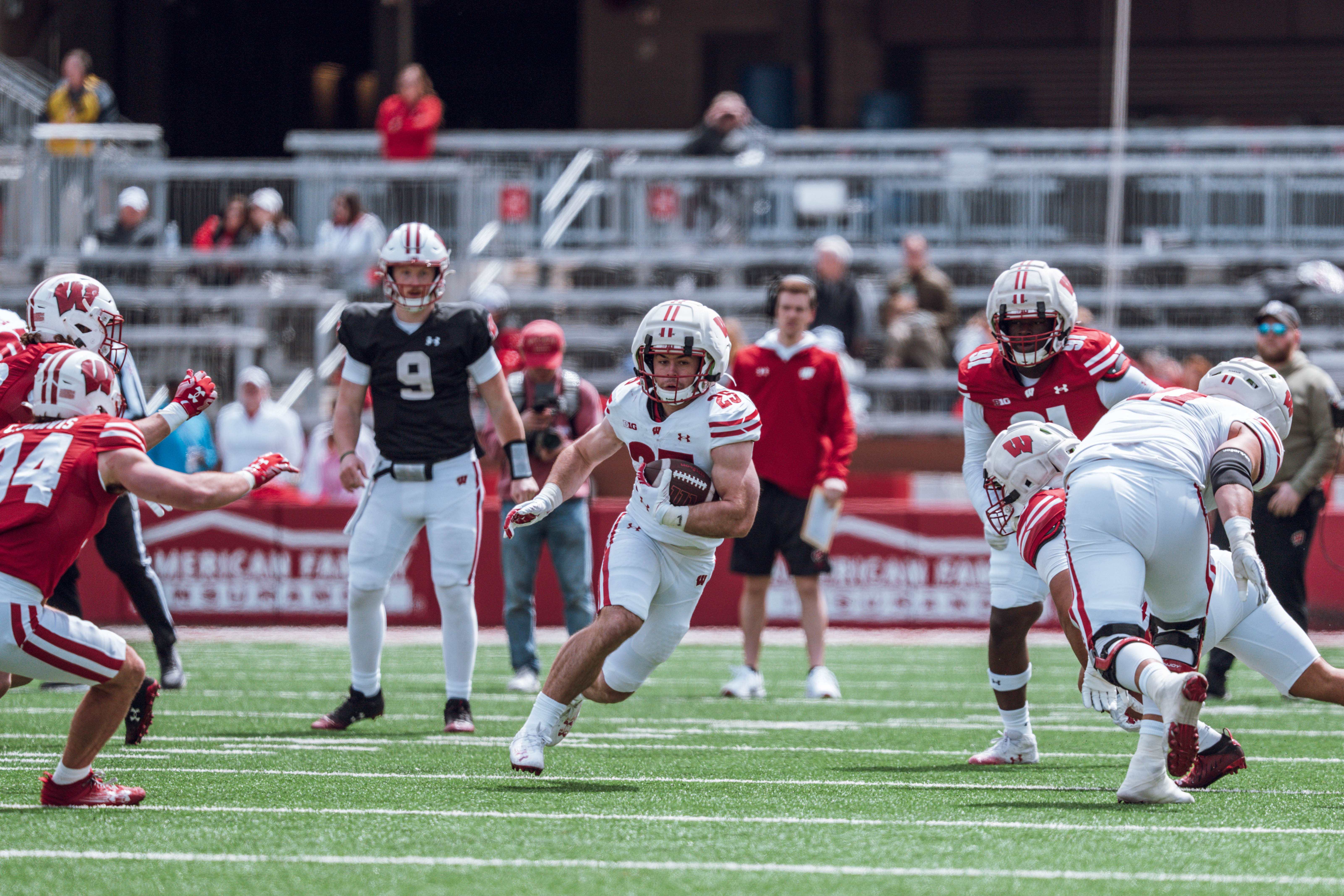Wisconsin Badgers running back Cade Yacamelli #25 finds the hole during the Wisconsin Football Spring Showcase at Camp Randall Stadium on April 19, 2025 in Madison, Wisconsin. Photography by Ross Harried for Second Crop Sports.