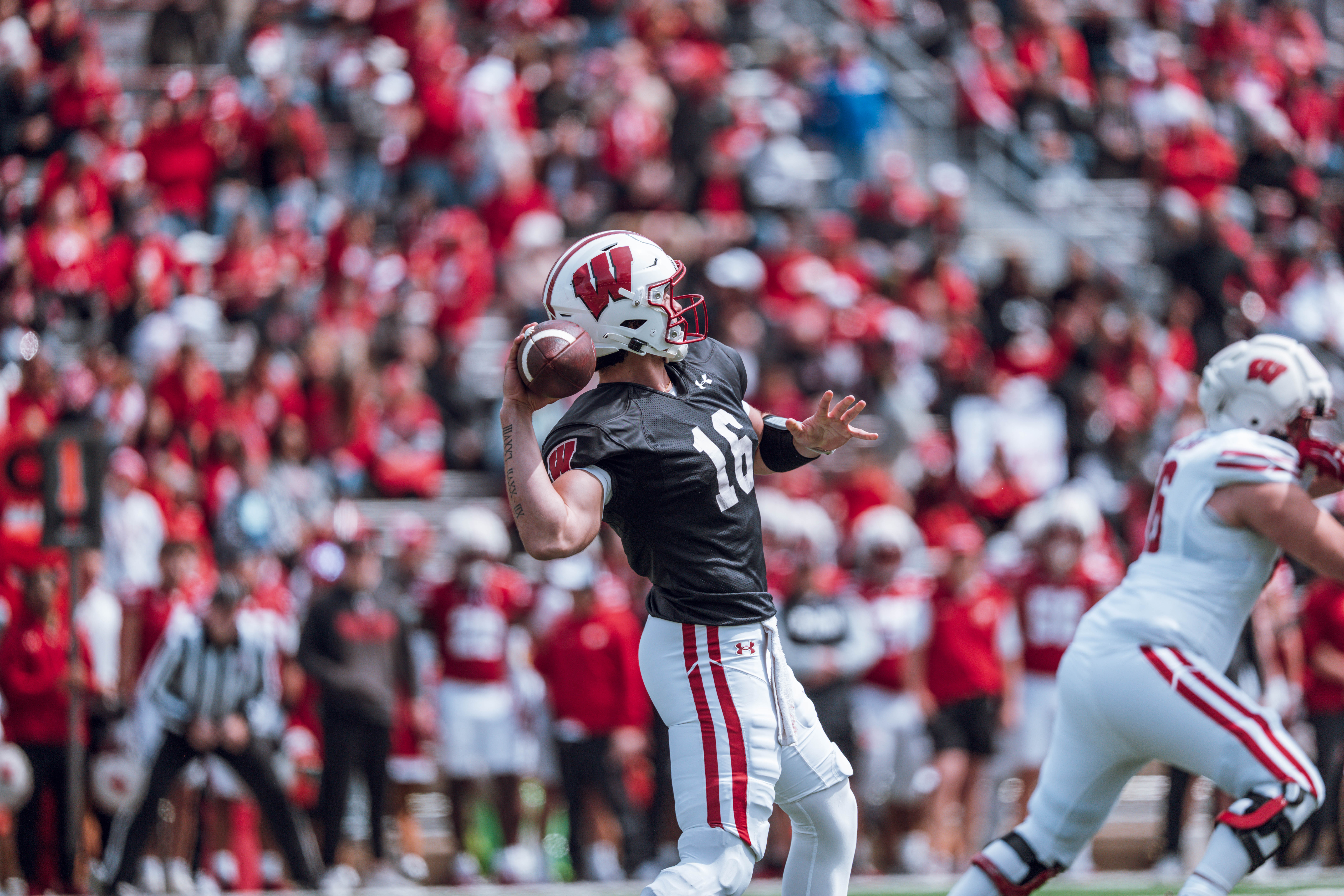 Wisconsin Badgers quarterback Milos Spasojevic #16 drops back to pass during the Wisconsin Football Spring Showcase at Camp Randall Stadium on April 19, 2025 in Madison, Wisconsin. Photography by Ross Harried for Second Crop Sports.