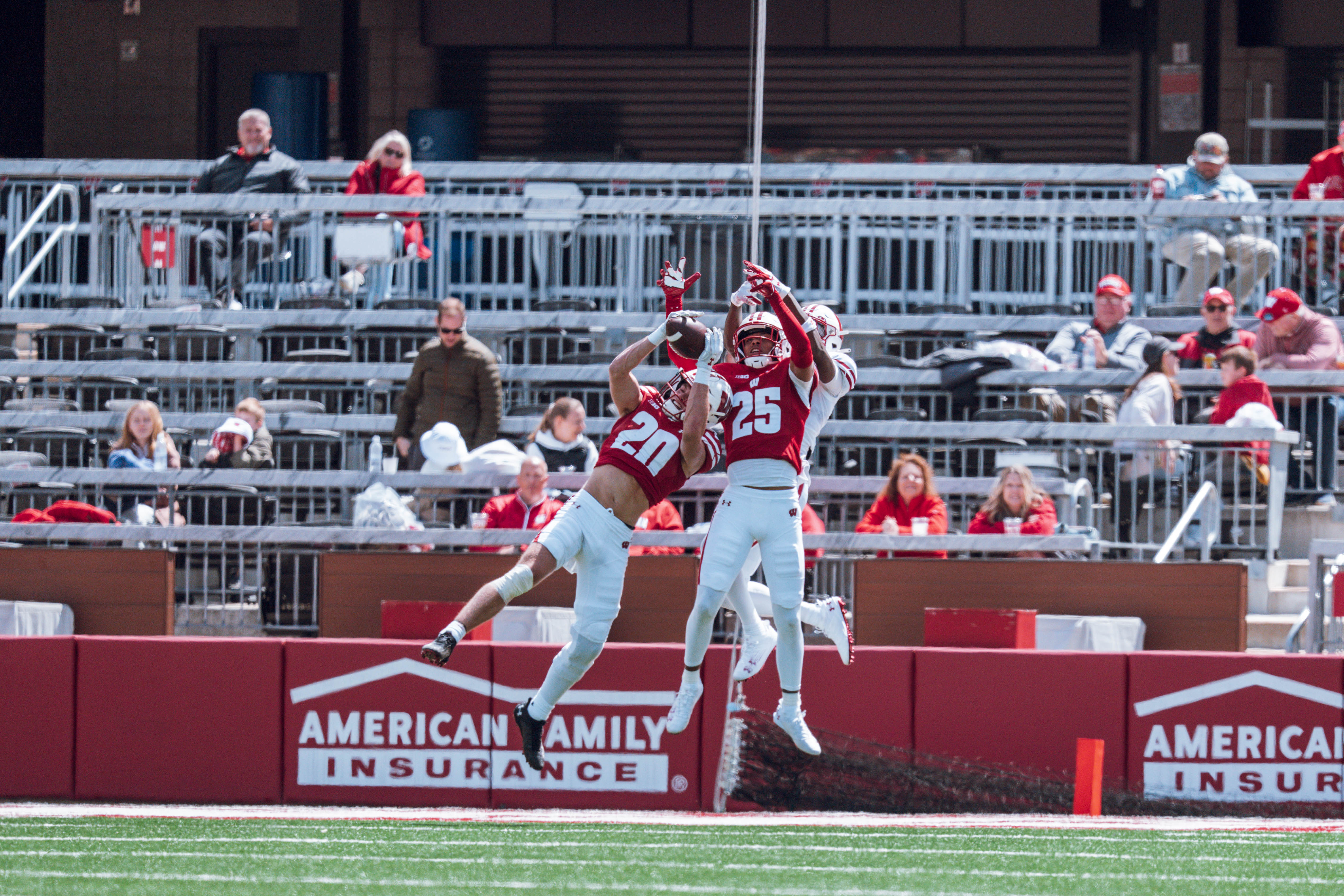 Wisconsin Badgers safety Luke Emmerich #20 intercepts a long pass during the Wisconsin Football Spring Showcase at Camp Randall Stadium on April 19, 2025 in Madison, Wisconsin. Photography by Ross Harried for Second Crop Sports.