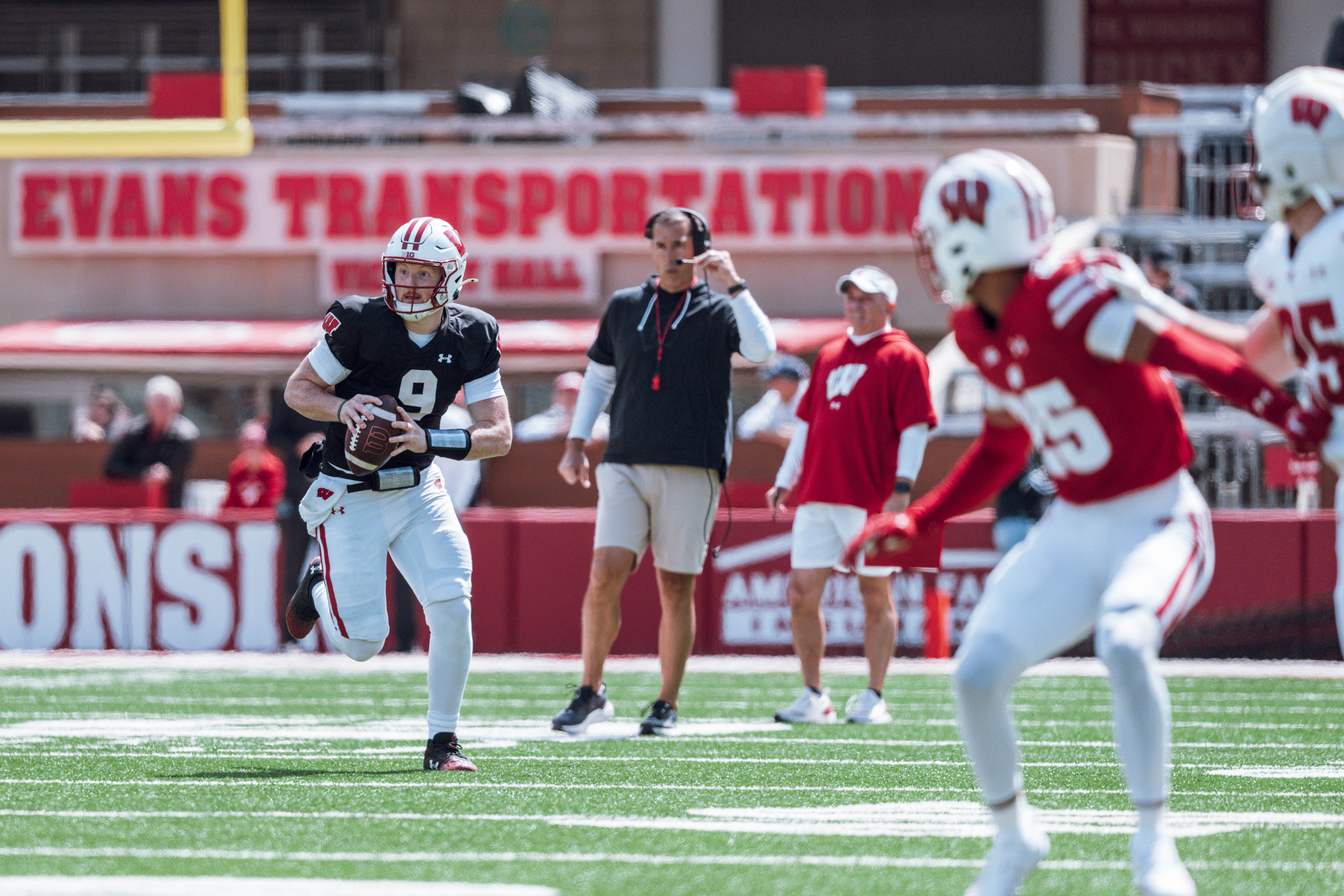 Wisconsin Badgers quarterback Billy Edwards Jr. #9 looks to pass down field as Wisconsin Badgers head coach Luke Fickell looks on during the Wisconsin Football Spring Showcase at Camp Randall Stadium on April 19, 2025 in Madison, Wisconsin. Photography by Ross Harried for Second Crop Sports.
