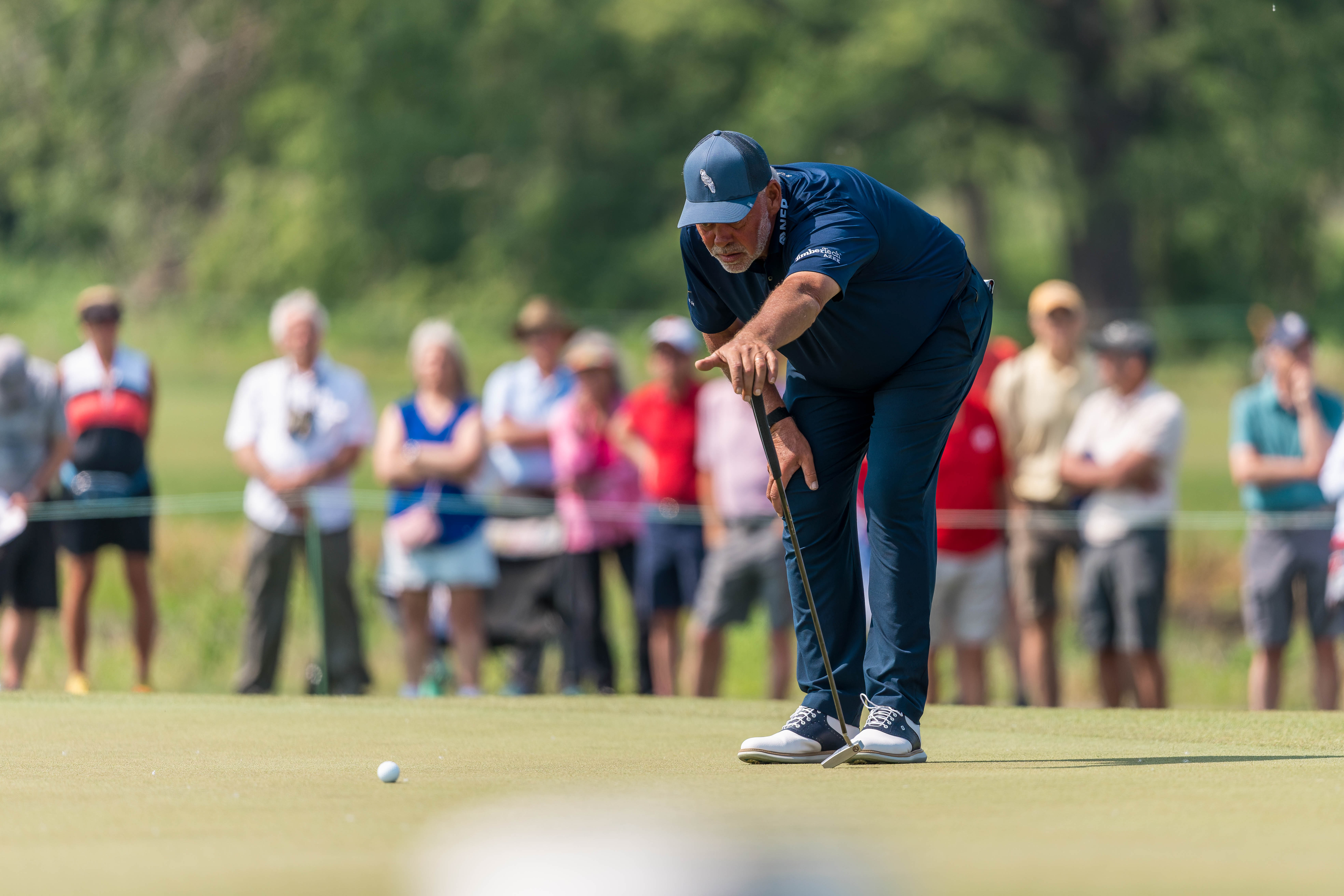 Darren Clarke lines up a putt on hole 1 during round 1 of The American Family Insurance Championship at TPC Wisconsin in Madison, Wisconsin on June 6th, 2025. Photography by Ross Harried for Second Crop Sports.