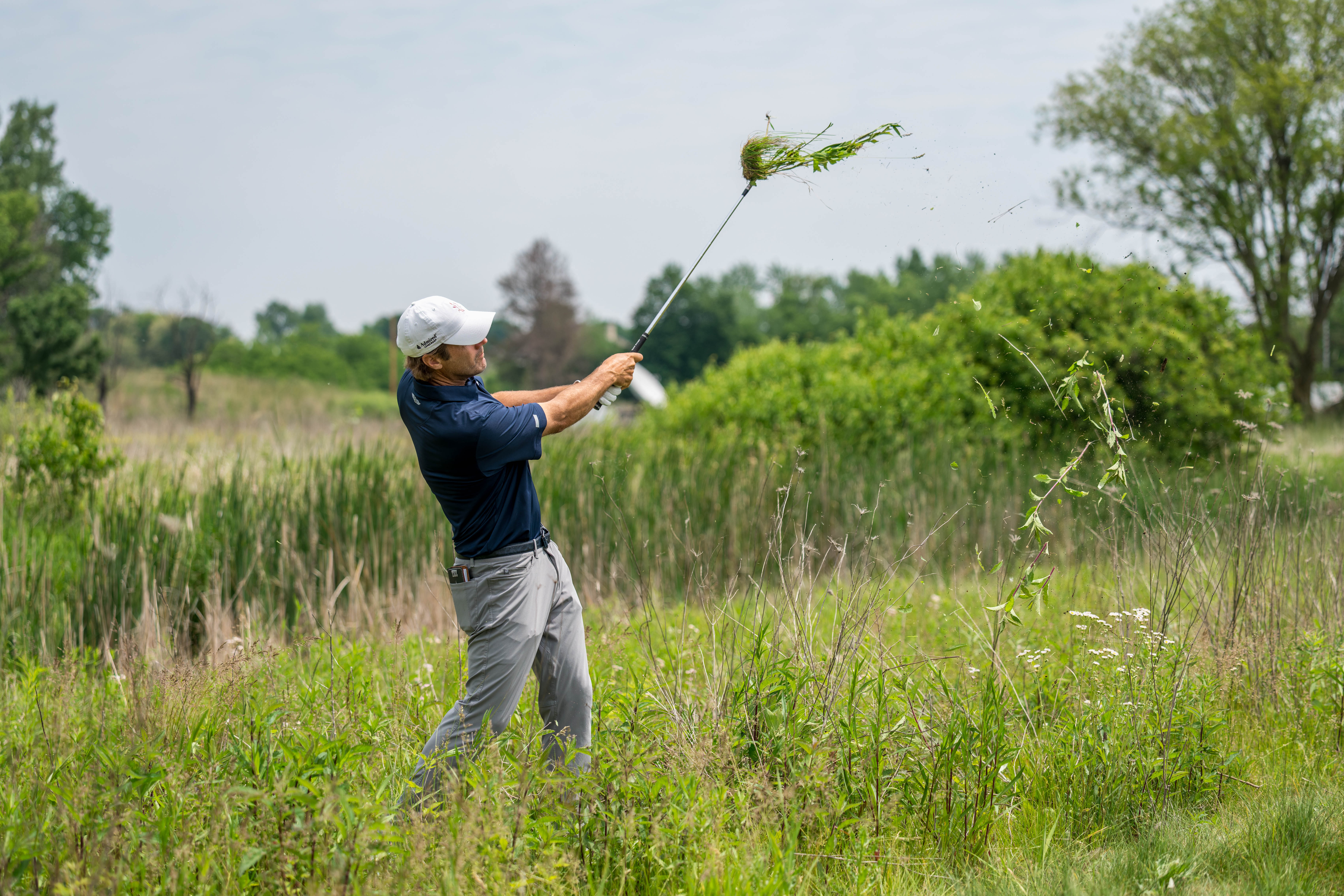 Mario Tiziani hits a shot from tall grass on hole 6 during round 1 of The American Family Insurance Championship at TPC Wisconsin in Madison, Wisconsin on June 6th, 2025. Photography by Ross Harried for Second Crop Sports.