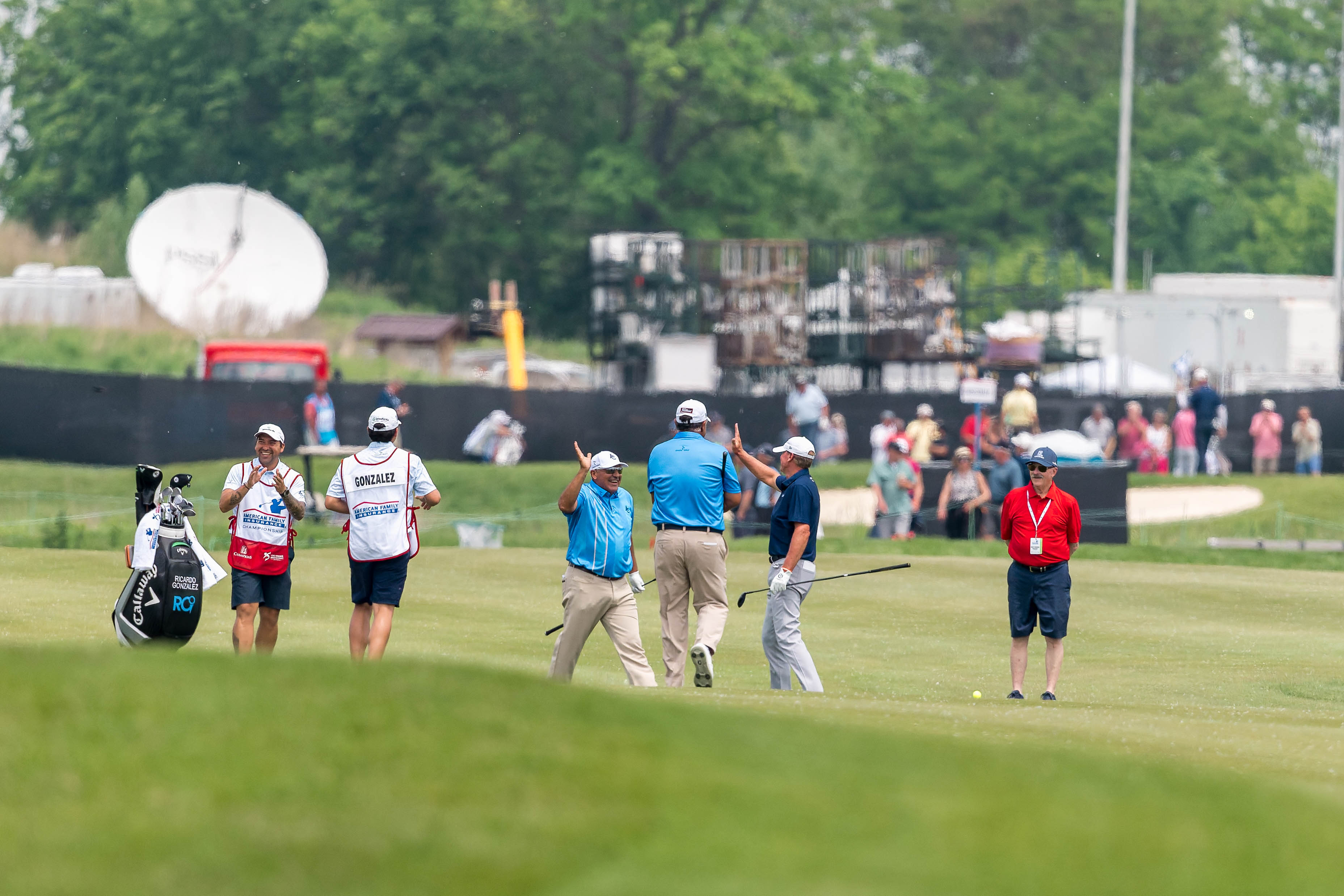 Ángel Cabrera (center left) celebrates a double eagle on hole 7 during round 1 of The American Family Insurance Championship at TPC Wisconsin in Madison, Wisconsin on June 6th, 2025. Photography by Ross Harried for Second Crop Sports.