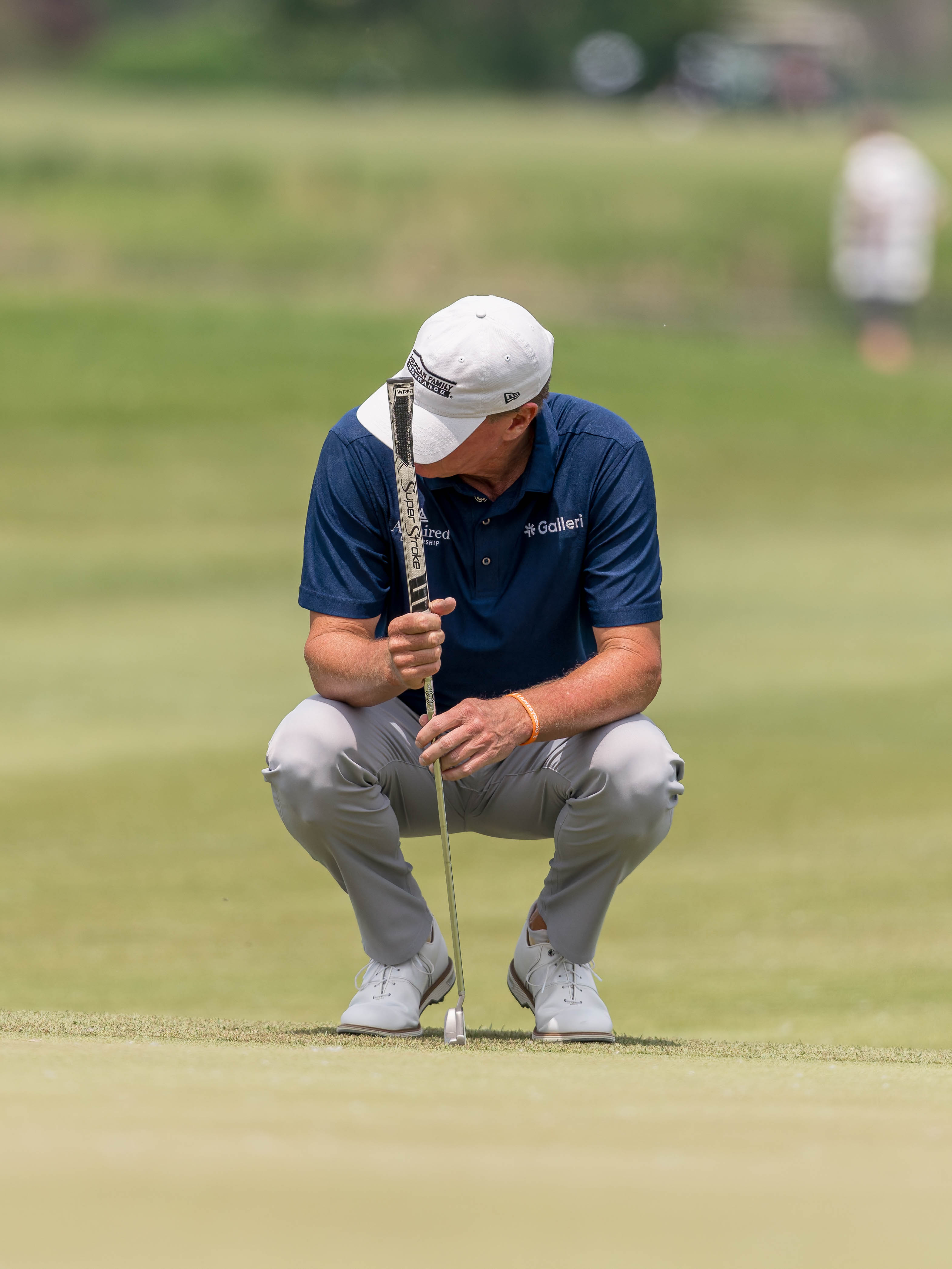 Steve Stricker squats down to rest on hole 7 during round 1 of The American Family Insurance Championship at TPC Wisconsin in Madison, Wisconsin on June 6th, 2025. Photography by Ross Harried for Second Crop Sports.