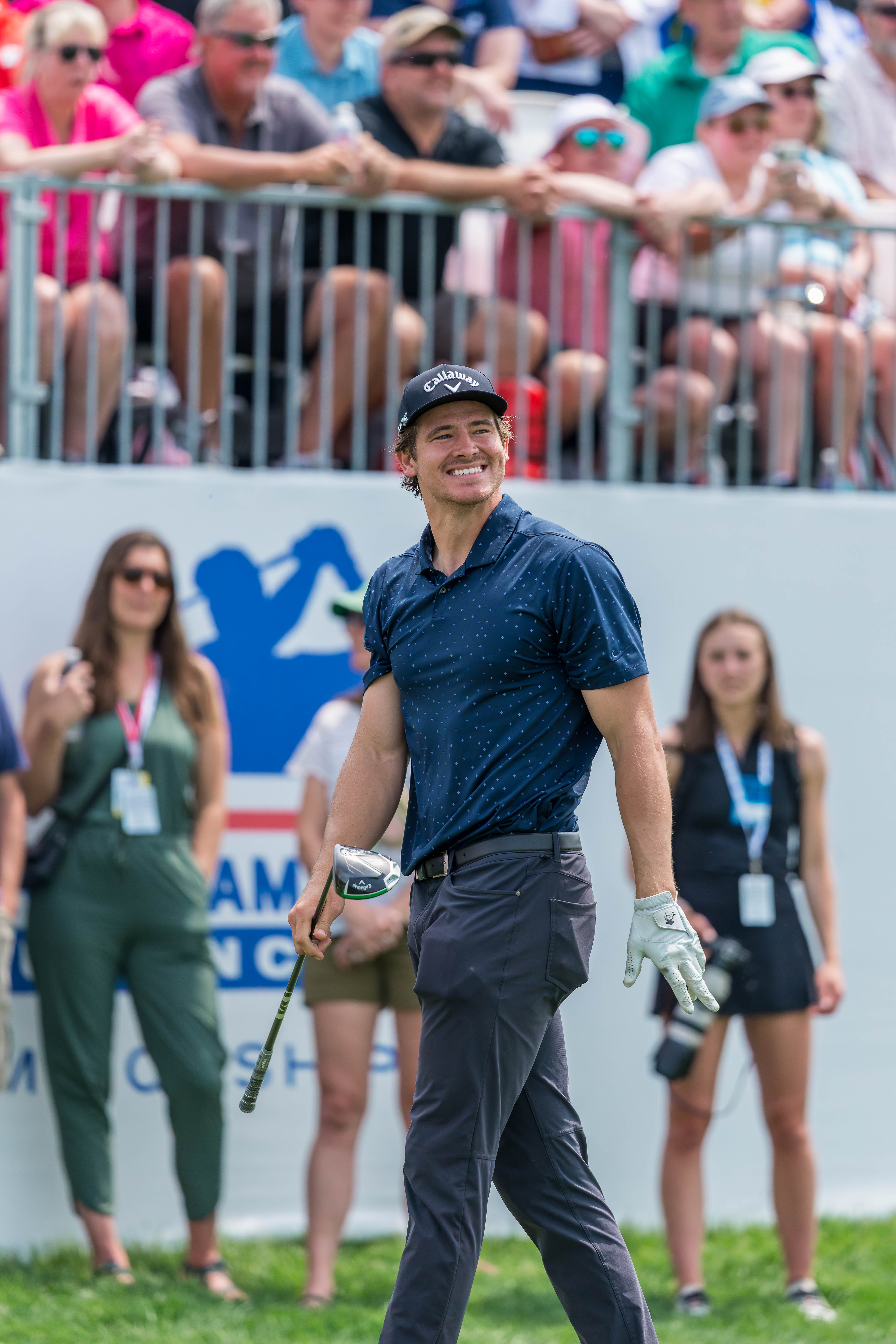 Justin Herbert smiles as he walks off the tee box of hole 1 during round 2 of The American Family Insurance Championship at TPC Wisconsin in Madison, Wisconsin on June 7th, 2025. Photography by Ross Harried for Second Crop Sports.