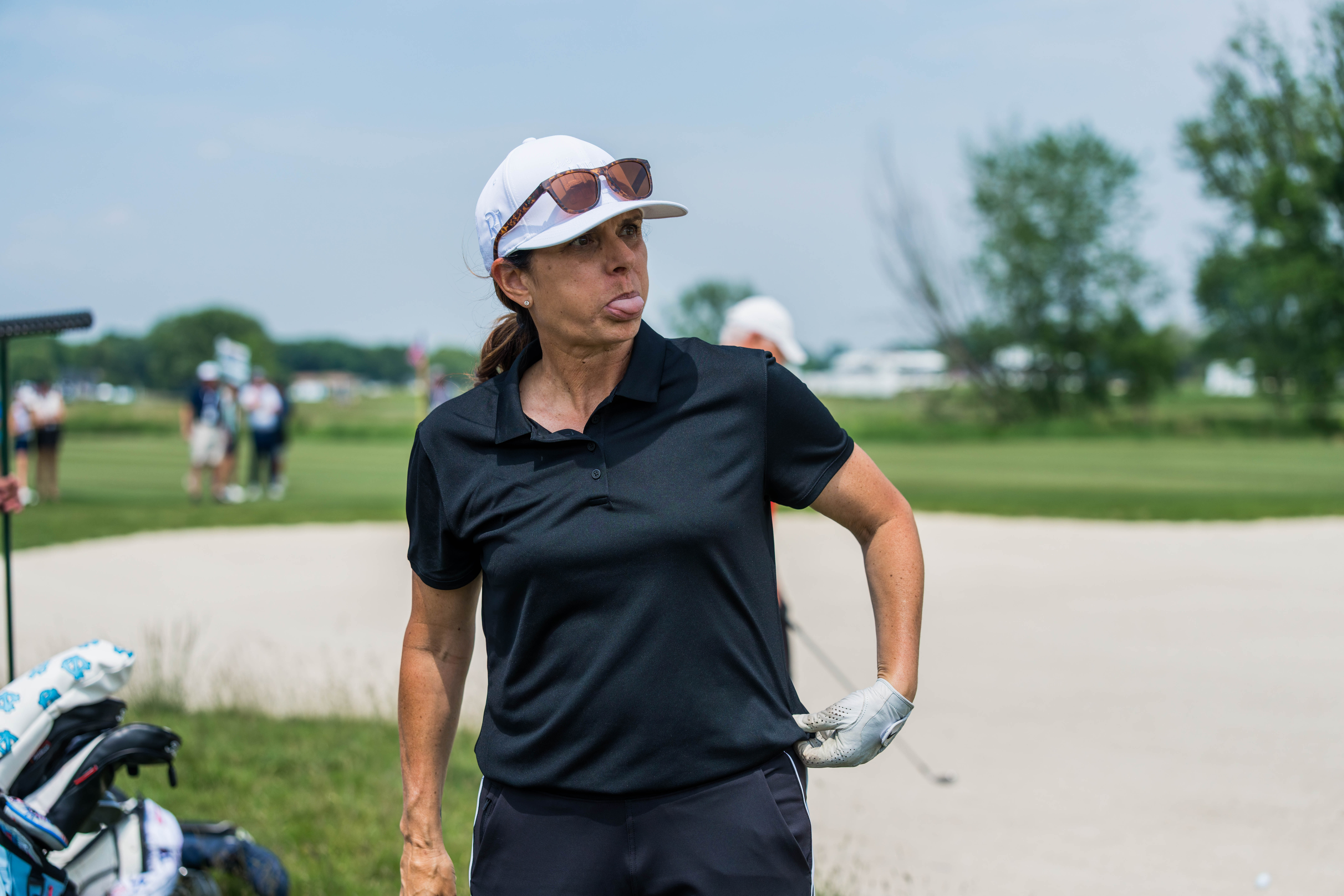 Mia Hamm reacts to a shot from the bunker on hole 11 during round 2 of The American Family Insurance Championship at TPC Wisconsin in Madison, Wisconsin on June 7th, 2025. Photography by Ross Harried for Second Crop Sports.