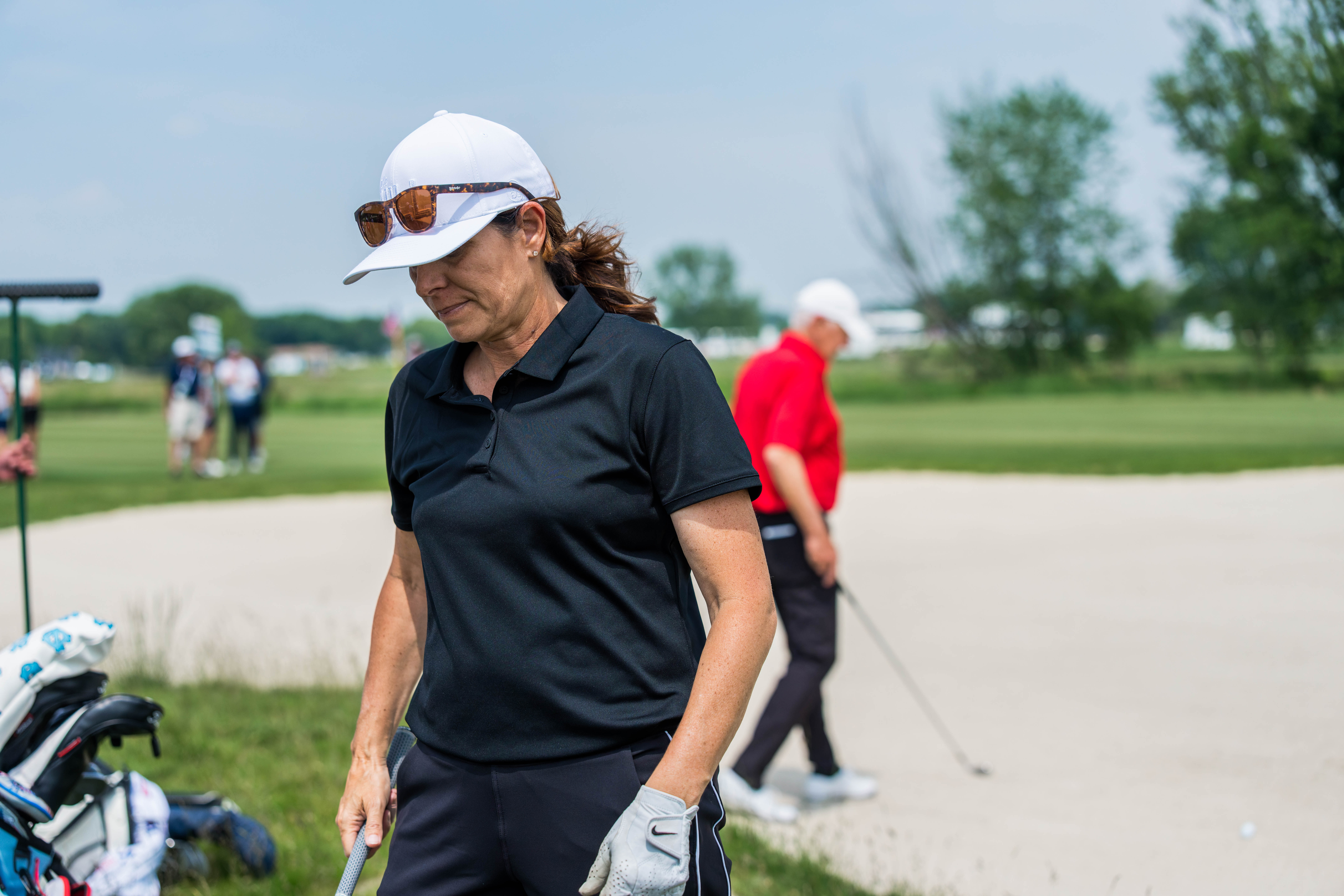 Mia Hamm reacts to a shot from the bunker on hole 11 during round 2 of The American Family Insurance Championship at TPC Wisconsin in Madison, Wisconsin on June 7th, 2025. Photography by Ross Harried for Second Crop Sports.