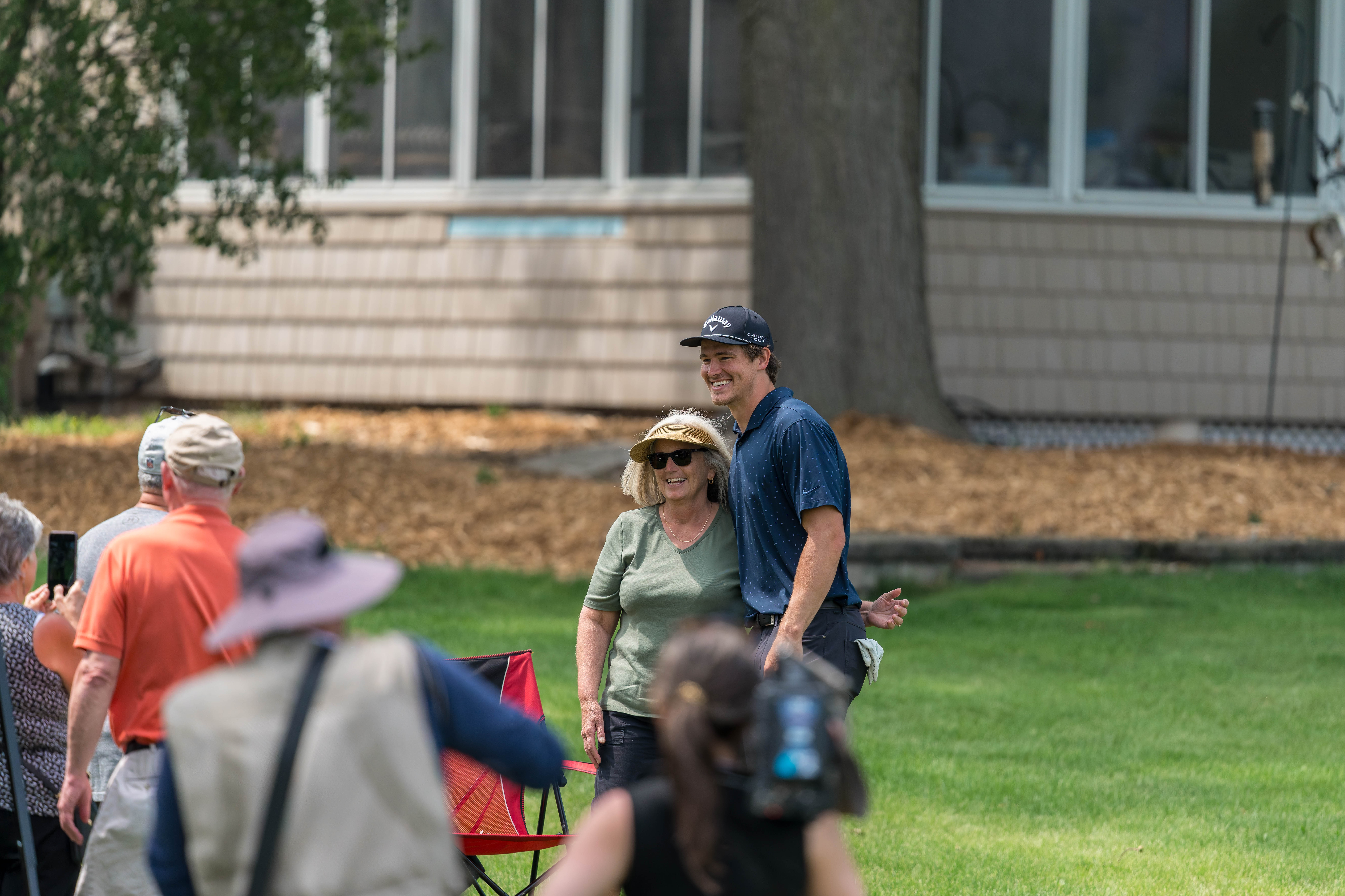 Justin Herbert poses for a picture with a fan on hole 12 during round 2 of The American Family Insurance Championship at TPC Wisconsin in Madison, Wisconsin on June 7th, 2025. Photography by Ross Harried for Second Crop Sports.
