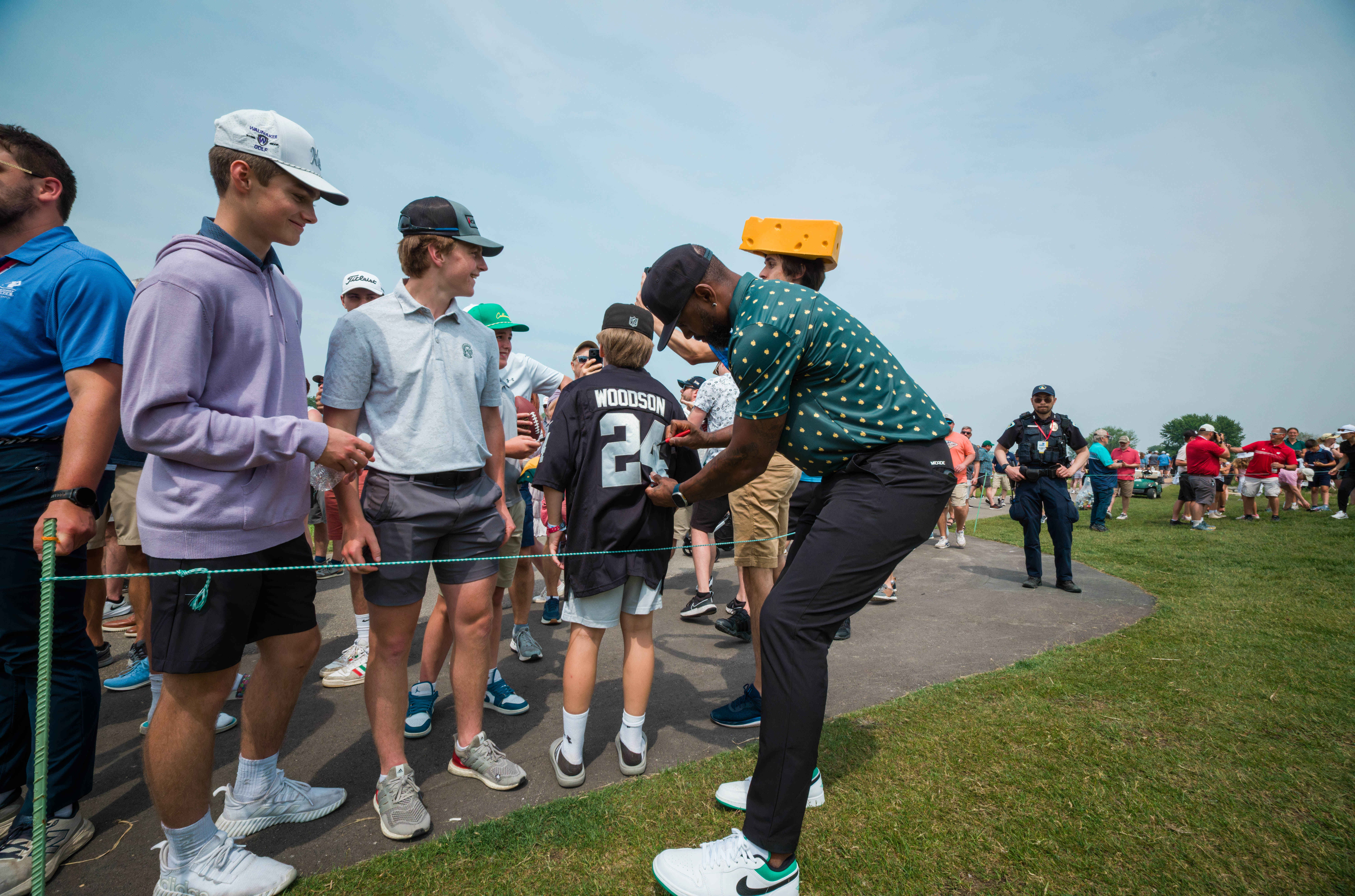 Charles Woodson signs a fan’s jersey during round 2 of The American Family Insurance Championship at TPC Wisconsin in Madison, Wisconsin on June 7th, 2025. Photography by Ross Harried for Second Crop Sports.