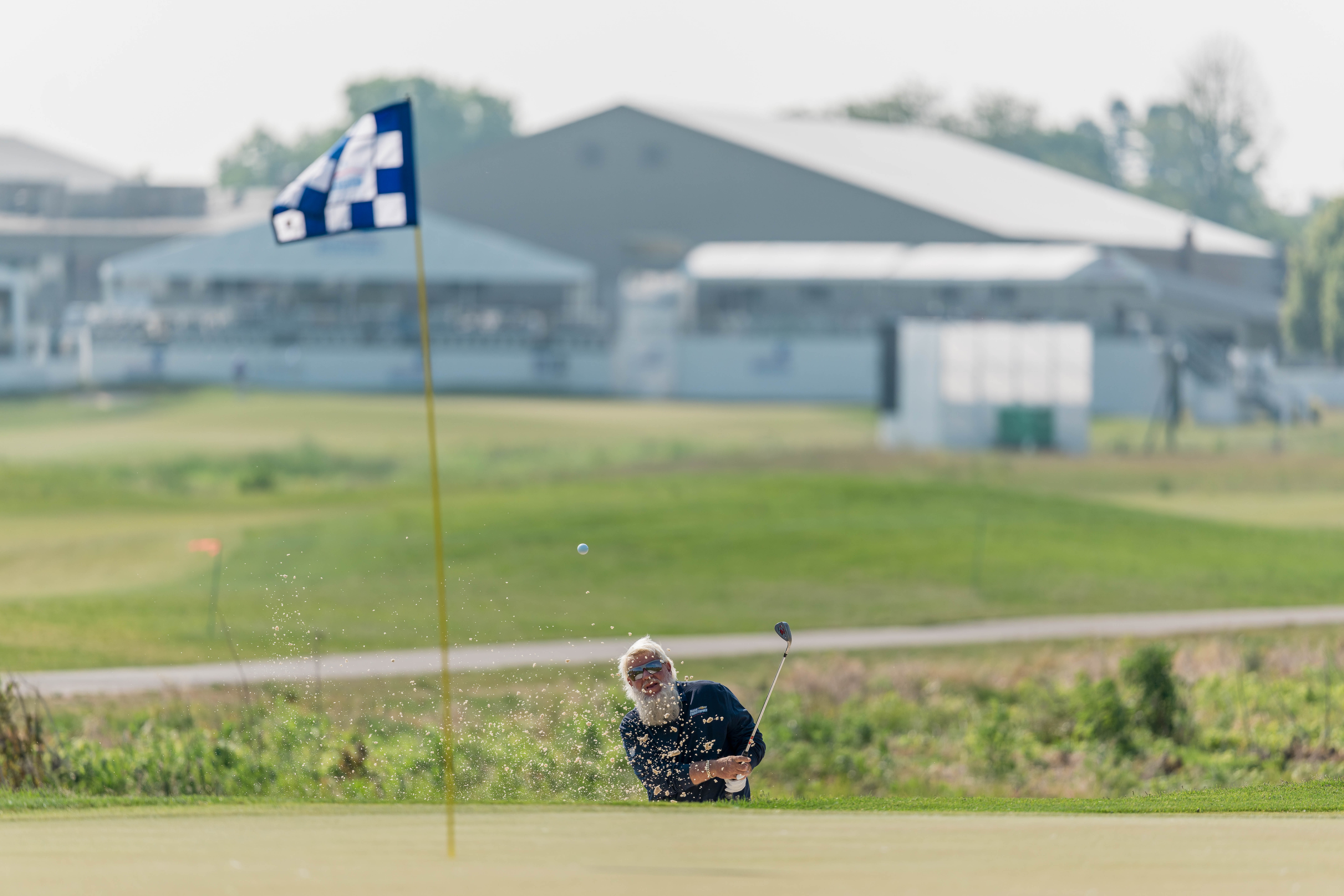 John Daly hits a shot form the bunker on hole 10 during round 3 of The American Family Insurance Championship at TPC Wisconsin in Madison, Wisconsin on June 8th, 2025. Photography by Ross Harried for Second Crop Sports.