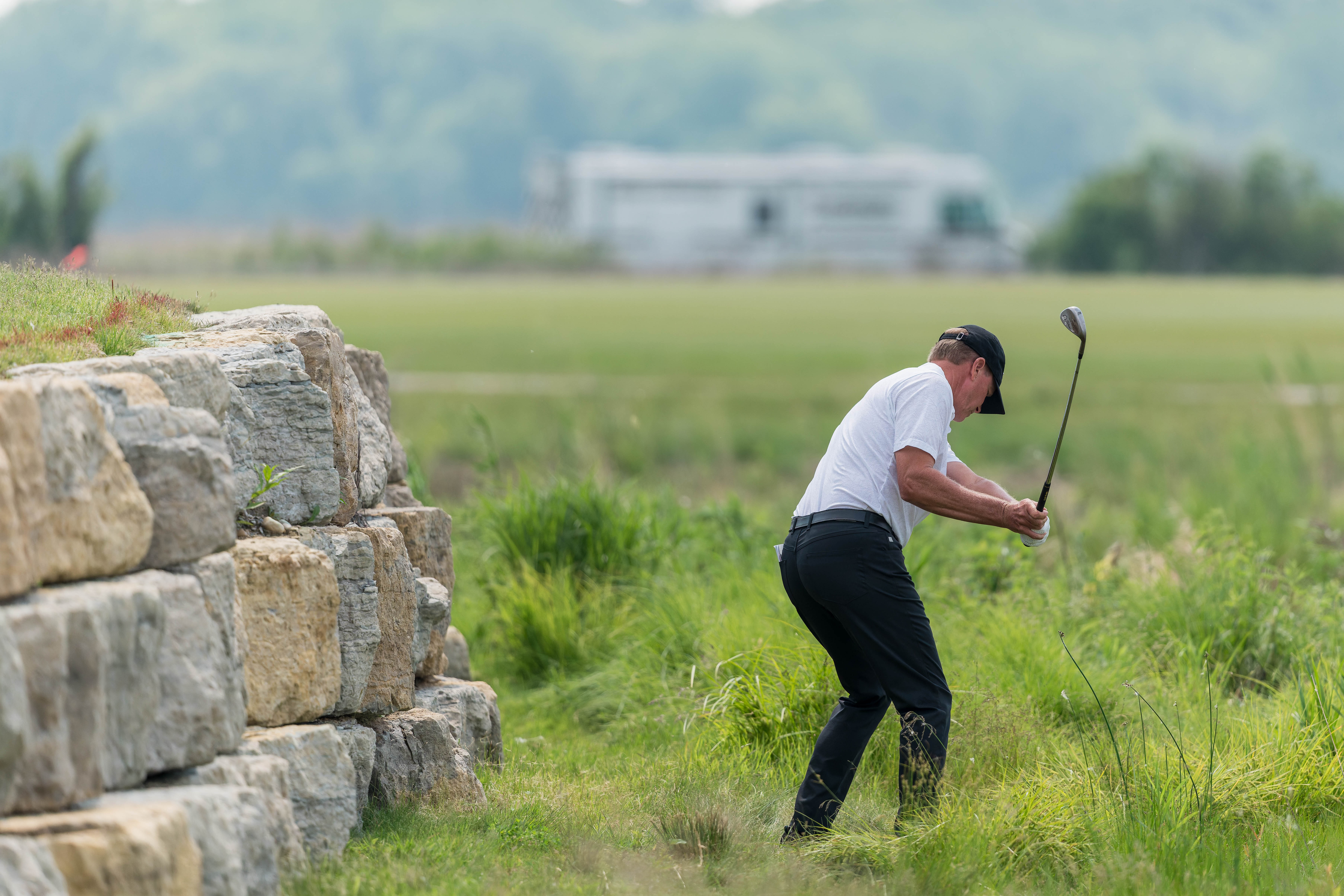 Steve Stricker hits a shot over a rock wall on hole 2 during round 3 of The American Family Insurance Championship at TPC Wisconsin in Madison, Wisconsin on June 8th, 2025. Photography by Ross Harried for Second Crop Sports.