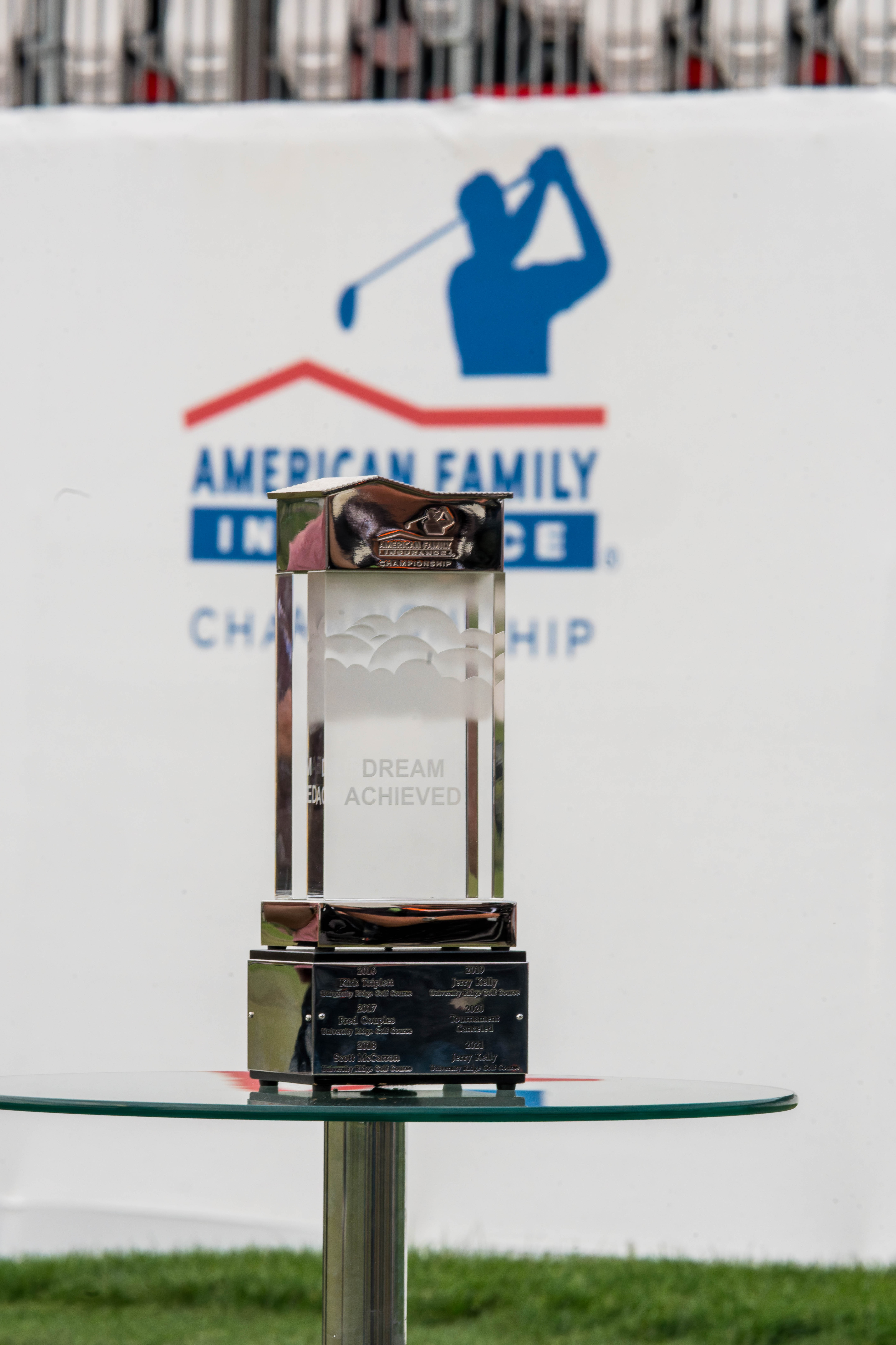 The American Family Insurance Championship Trophy on display on hole 18 after finishing round 3 of The American Family Insurance Championship at TPC Wisconsin in Madison, Wisconsin on June 8th, 2025. Photography by Ross Harried for Second Crop Sports.