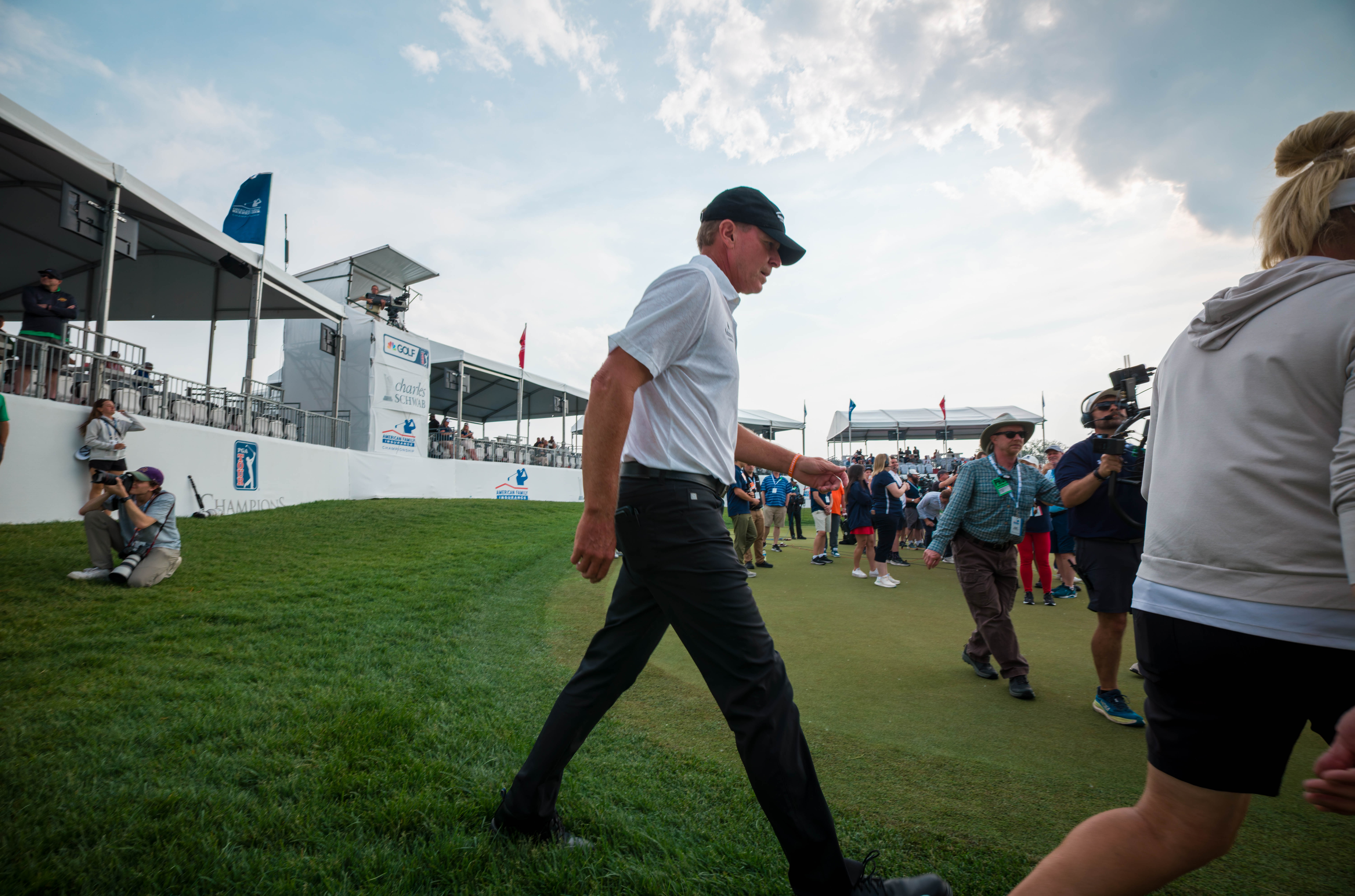 Host Steve Stricker returns to the green of hole 18 to present the American Family Insurance Championship Trophy after round 3 of The American Family Insurance Championship at TPC Wisconsin in Madison, Wisconsin on June 8th, 2025. Photography by Ross Harried for Second Crop Sports.