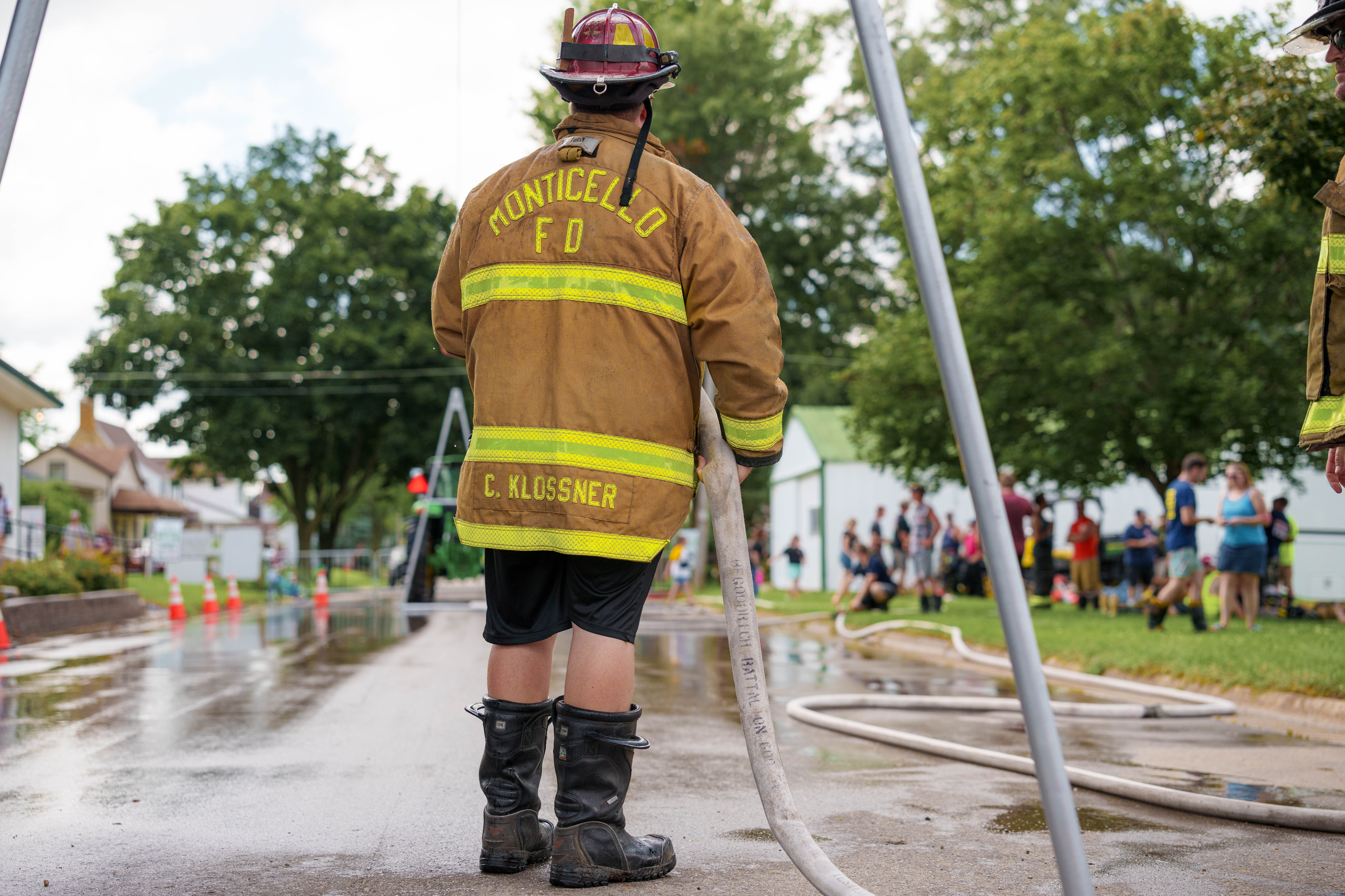 Firefighter water fight at the Green County Fair in Monroe, Wisconsin on July 19th, 2025. Photography by Ross Harried for Second Crop Sports.