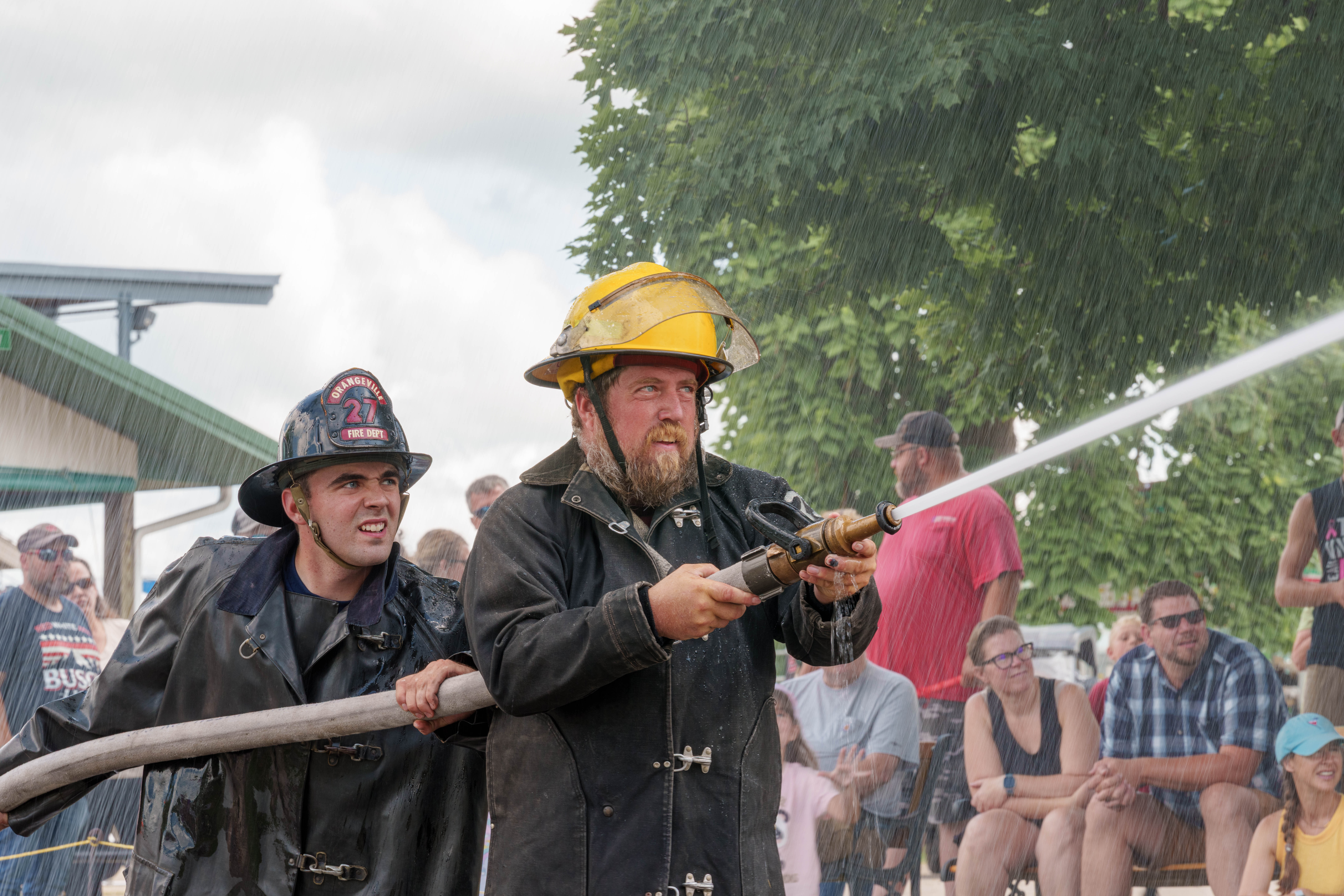 Firefighter water fight at the Green County Fair in Monroe, Wisconsin on July 19th, 2025. Photography by Ross Harried for Second Crop Sports.
