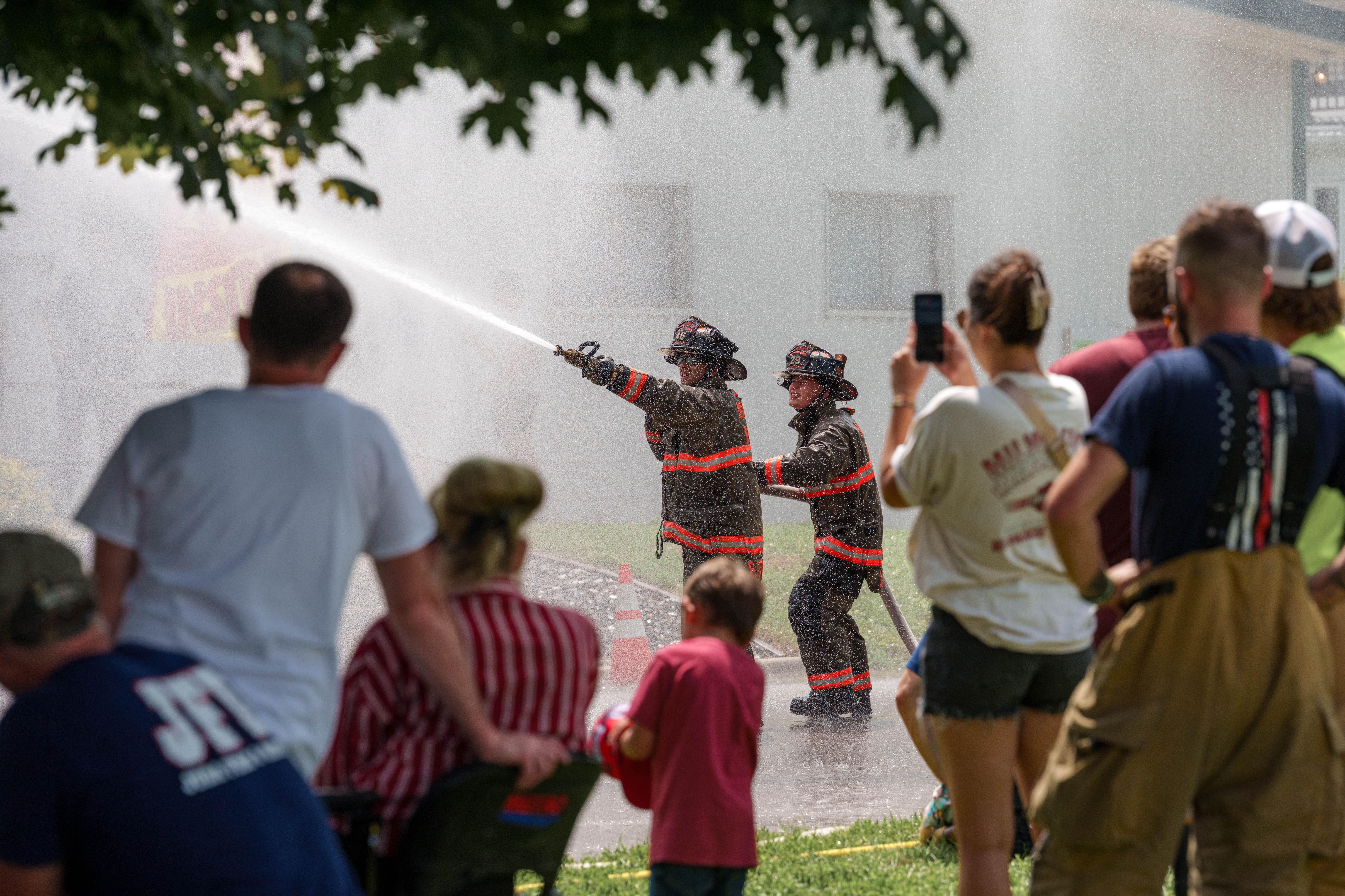 Firefighter water fight at the Green County Fair in Monroe, Wisconsin on July 19th, 2025. Photography by Ross Harried for Second Crop Sports.