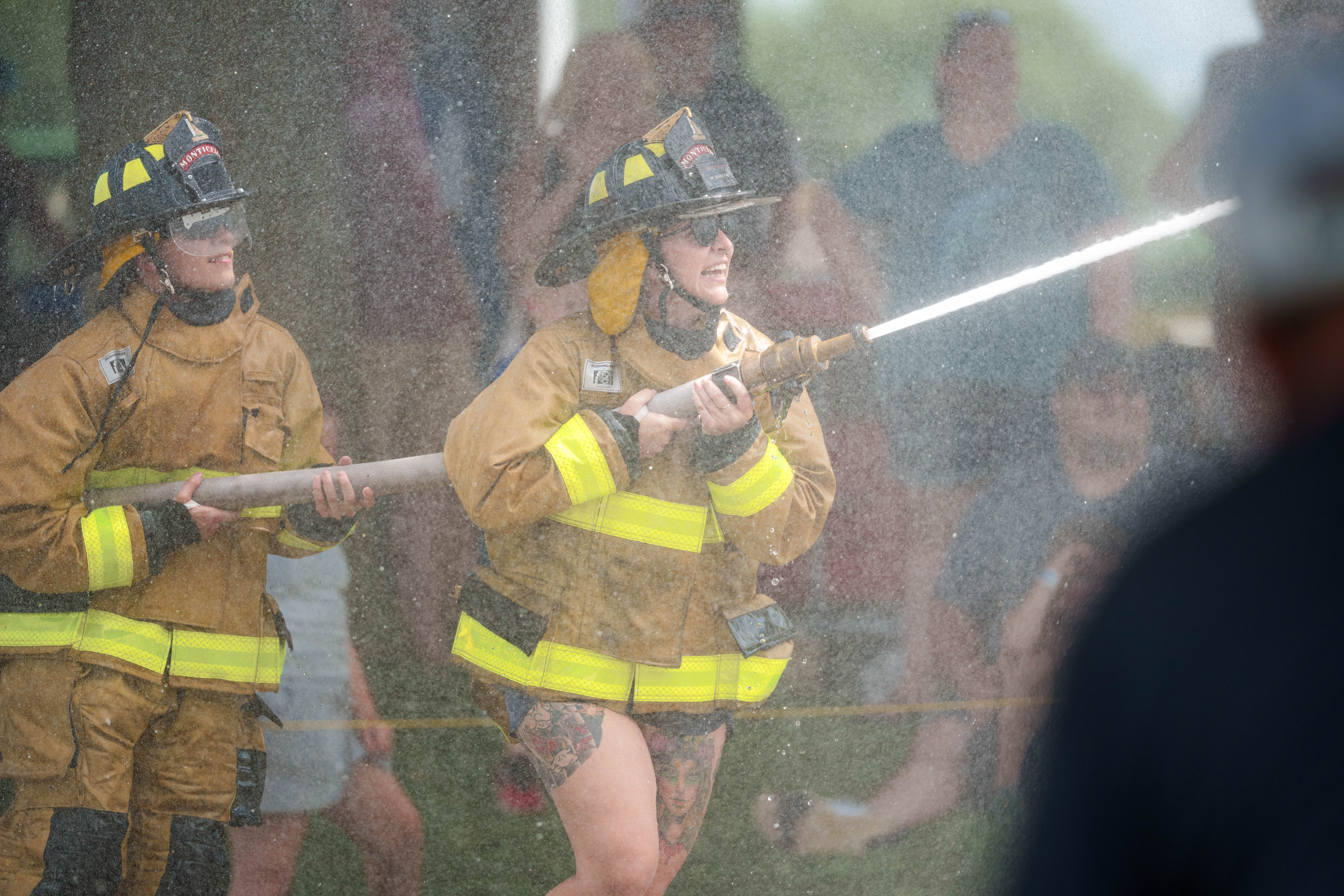 Firefighter water fight the Green County Fair in Monroe, Wisconsin on July 19th, 2025. Photography by Ross Harried for Second Crop Sports.