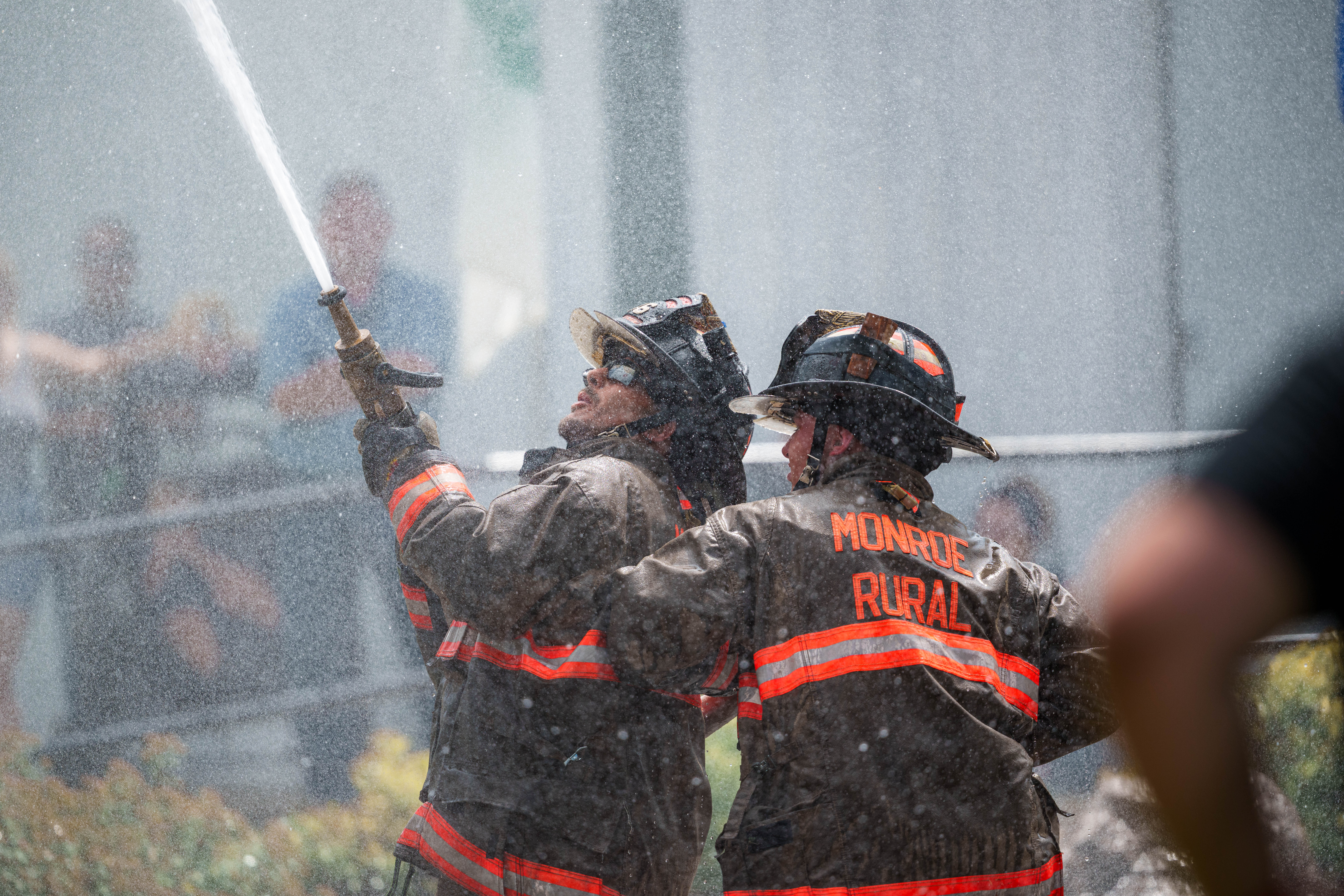 Firefighter water fight at the Green County Fair in Monroe, Wisconsin on July 19th, 2025. Photography by Ross Harried for Second Crop Sports.