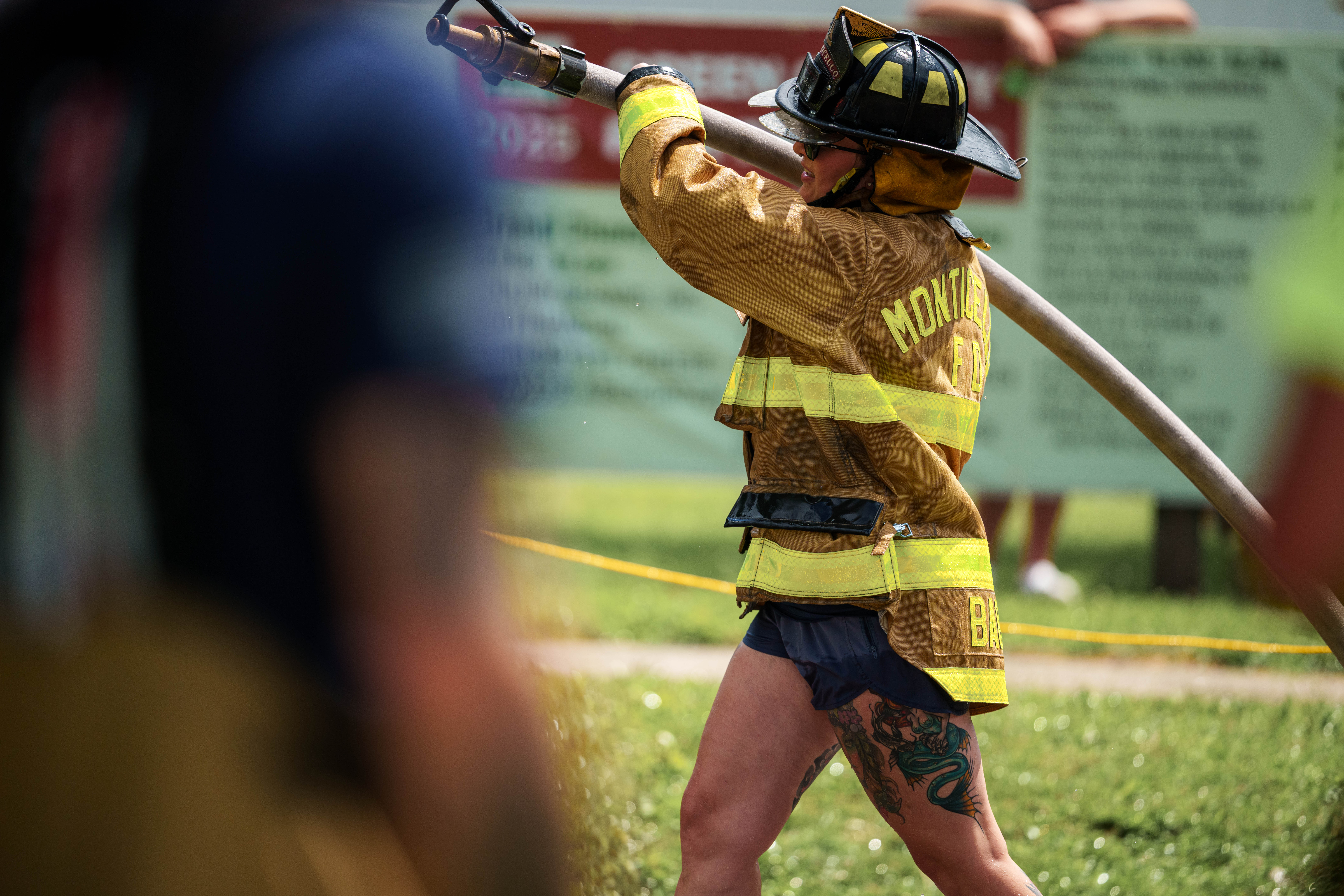 Firefighter water fight at the Green County Fair in Monroe, Wisconsin on July 19th, 2025. Photography by Ross Harried for Second Crop Sports.