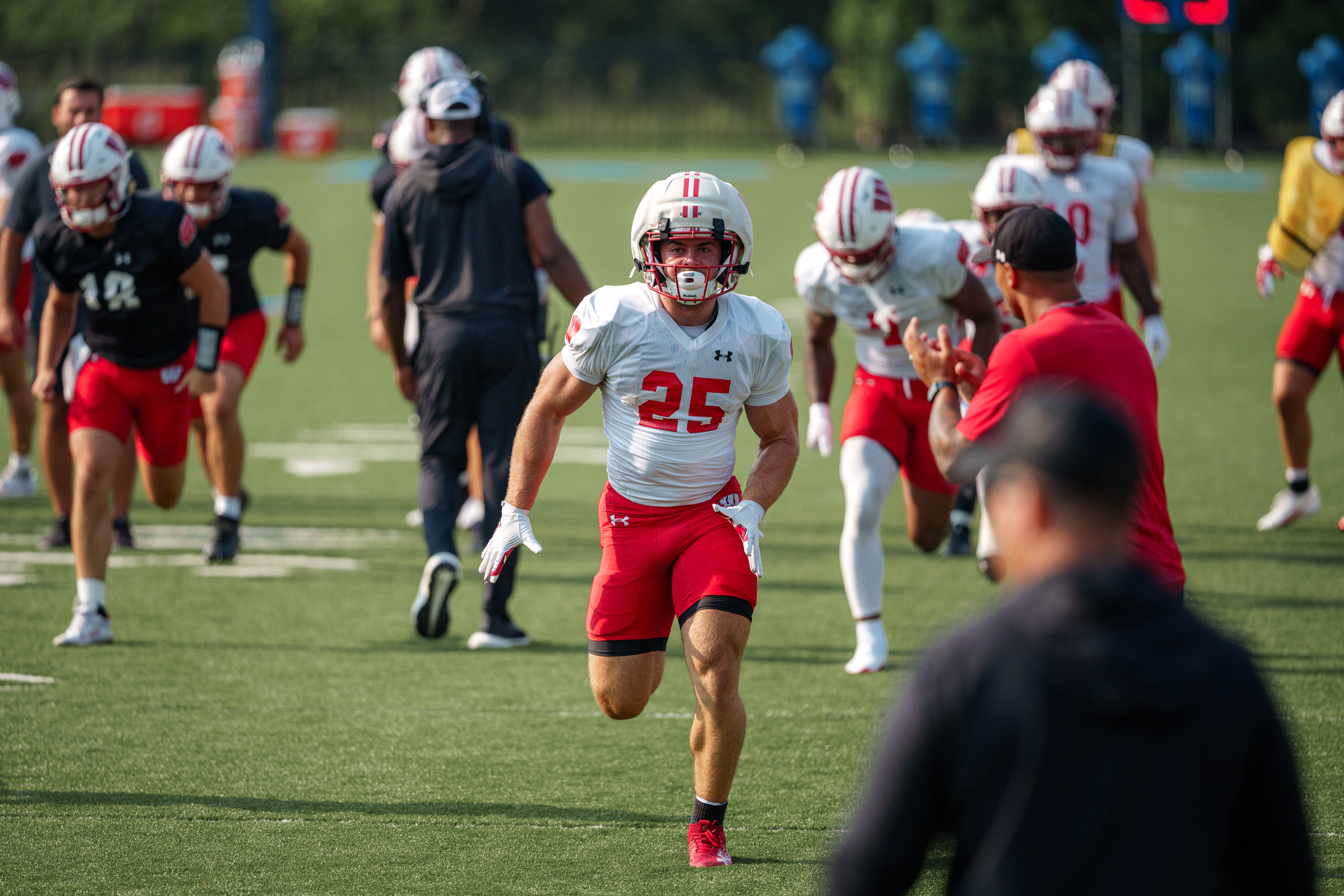 Wisconsin Badgers running back Cade Yacamelli (25) does sprints during training camp at Ralph E. Davis Pioneer Stadium on August 03, 2025 in Platteville, Wisconsin. Photography by Ross Harried for Second Crop Sports.