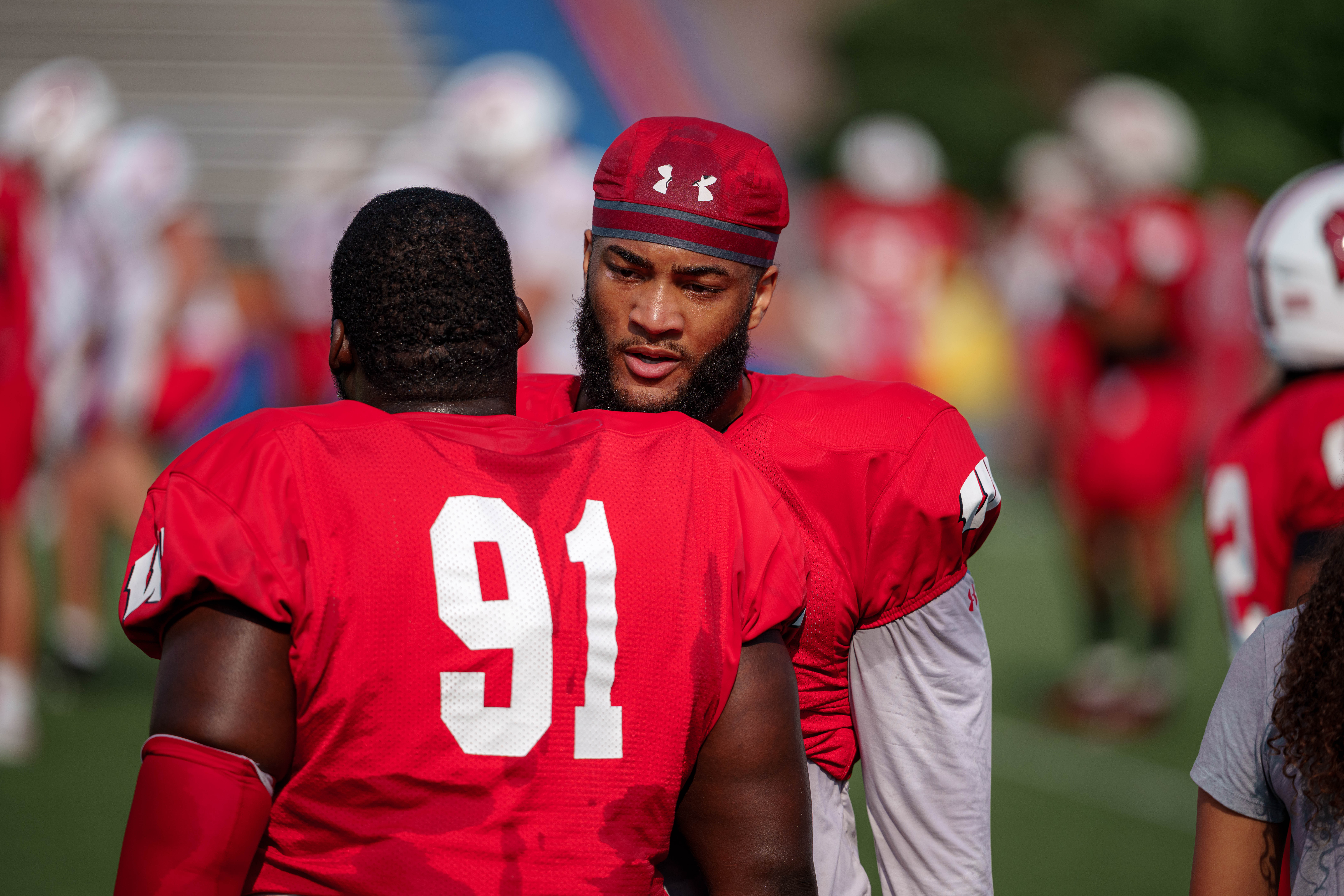 Wisconsin Badgers defensive lineman Jamel Howard Jr. (91) and teammate during training camp at Ralph E. Davis Pioneer Stadium on August 03, 2025 in Platteville, Wisconsin. Photography by Ross Harried for Second Crop Sports.