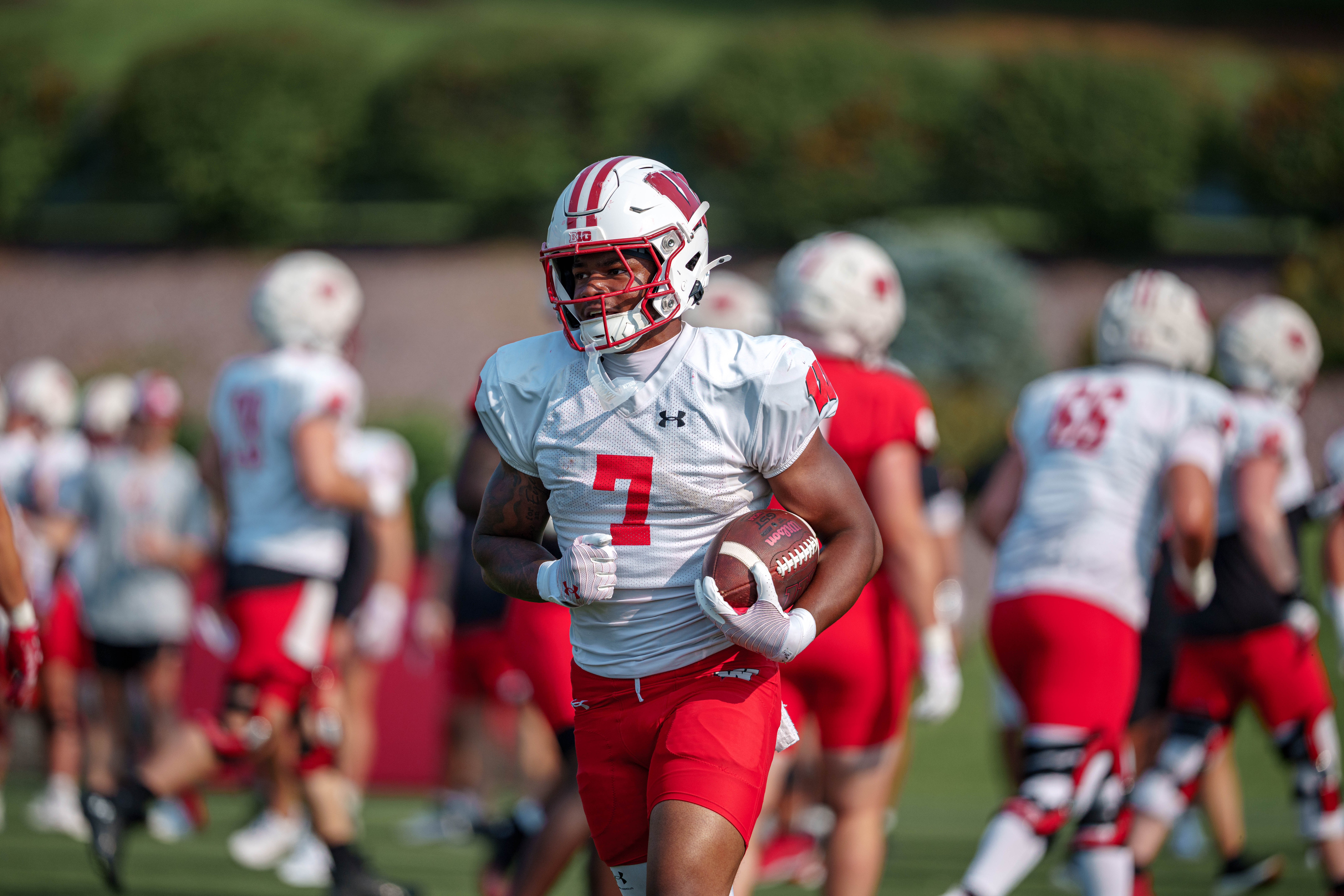 Wisconsin Badgers running back Dilin Jones (7) runs the ball during training camp at Ralph E. Davis Pioneer Stadium on August 03, 2025 in Platteville, Wisconsin. Photography by Ross Harried for Second Crop Sports.