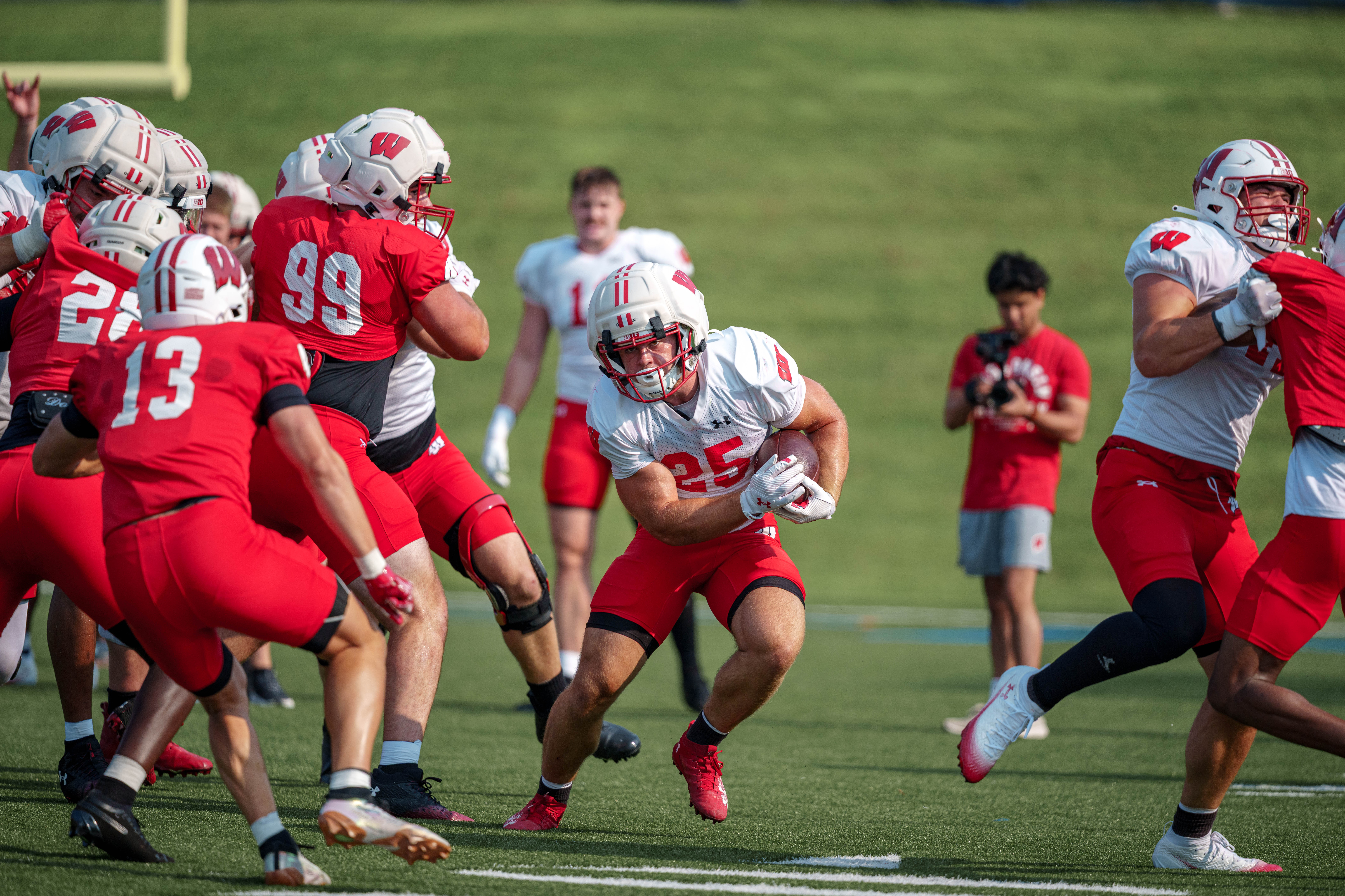 Wisconsin Badgers running back Cade Yacamelli (25) runs the ball during training camp at Ralph E. Davis Pioneer Stadium on August 03, 2025 in Platteville, Wisconsin. Photography by Ross Harried for Second Crop Sports.