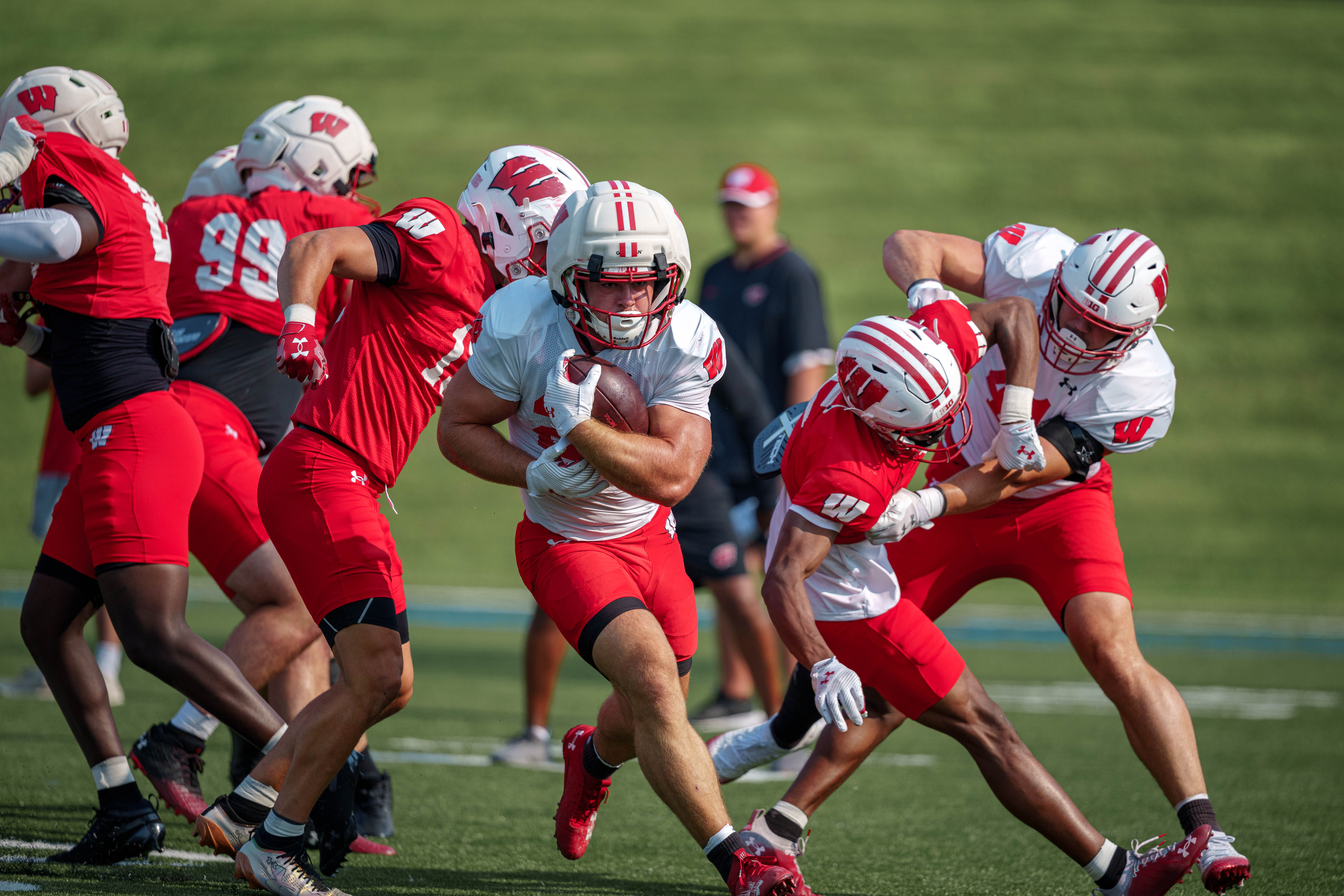 Wisconsin Badgers running back Cade Yacamelli (25) runs the ball during training camp at Ralph E. Davis Pioneer Stadium on August 03, 2025 in Platteville, Wisconsin. Photography by Ross Harried for Second Crop Sports.