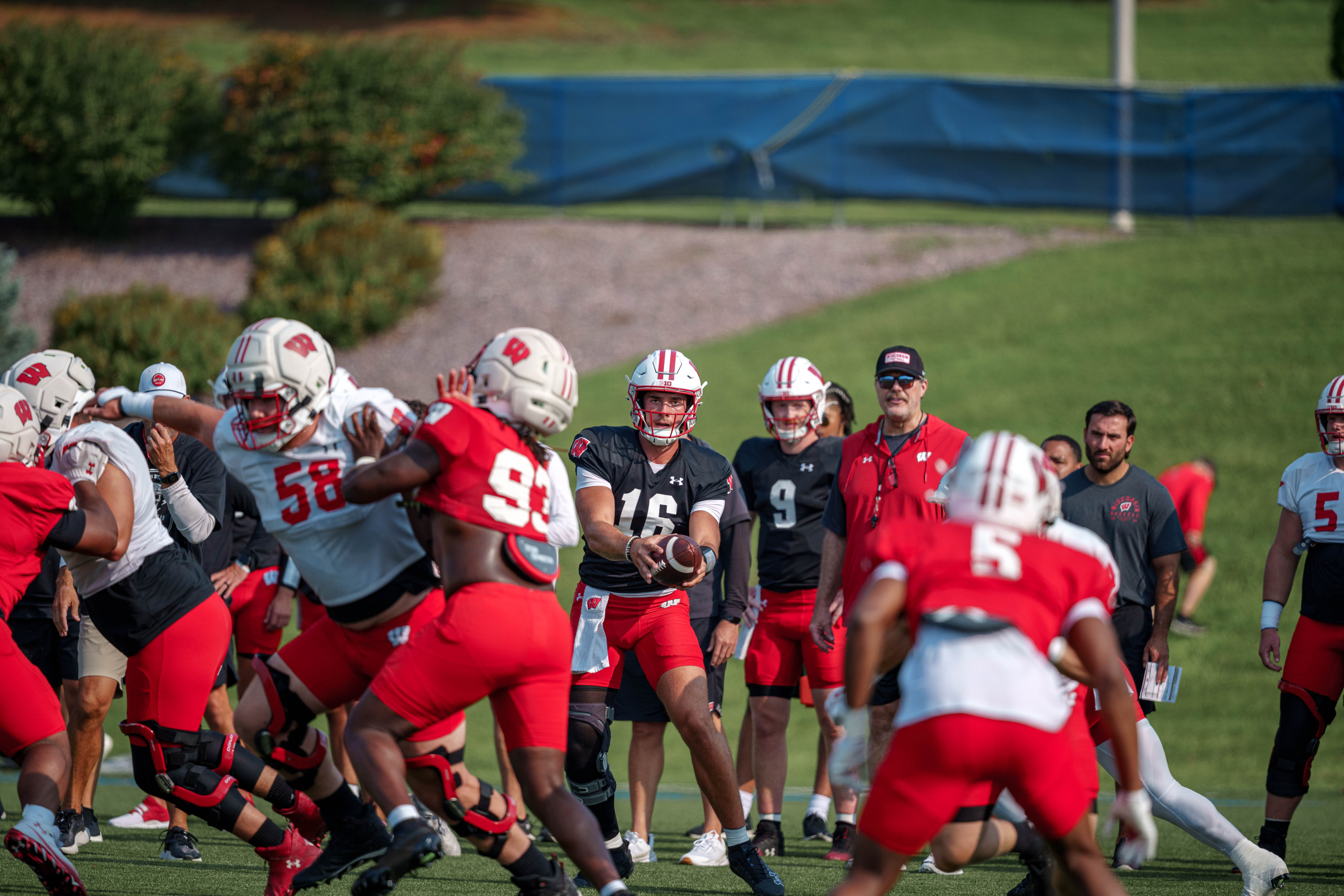 Wisconsin Badgers quarterback Milos Spasojevic (16) runs a playaction during training camp at Ralph E. Davis Pioneer Stadium on August 03, 2025 in Platteville, Wisconsin. Photography by Ross Harried for Second Crop Sports.
