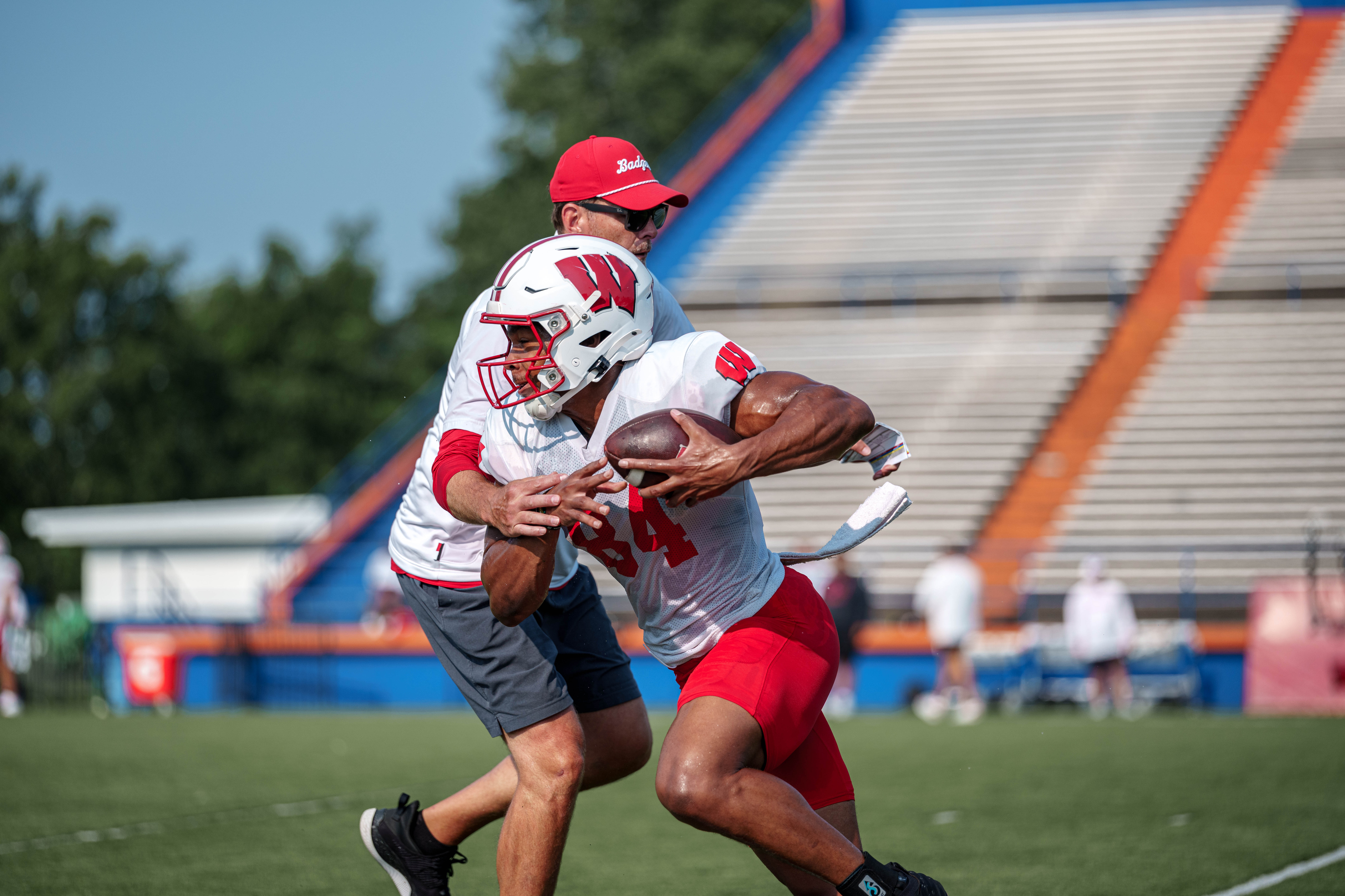 Wisconsin Badgers wide receiver Chris Brooks Jr. (84) turns up field after a catching drill during training camp at Ralph E. Davis Pioneer Stadium on August 03, 2025 in Platteville, Wisconsin. Photography by Ross Harried for Second Crop Sports.