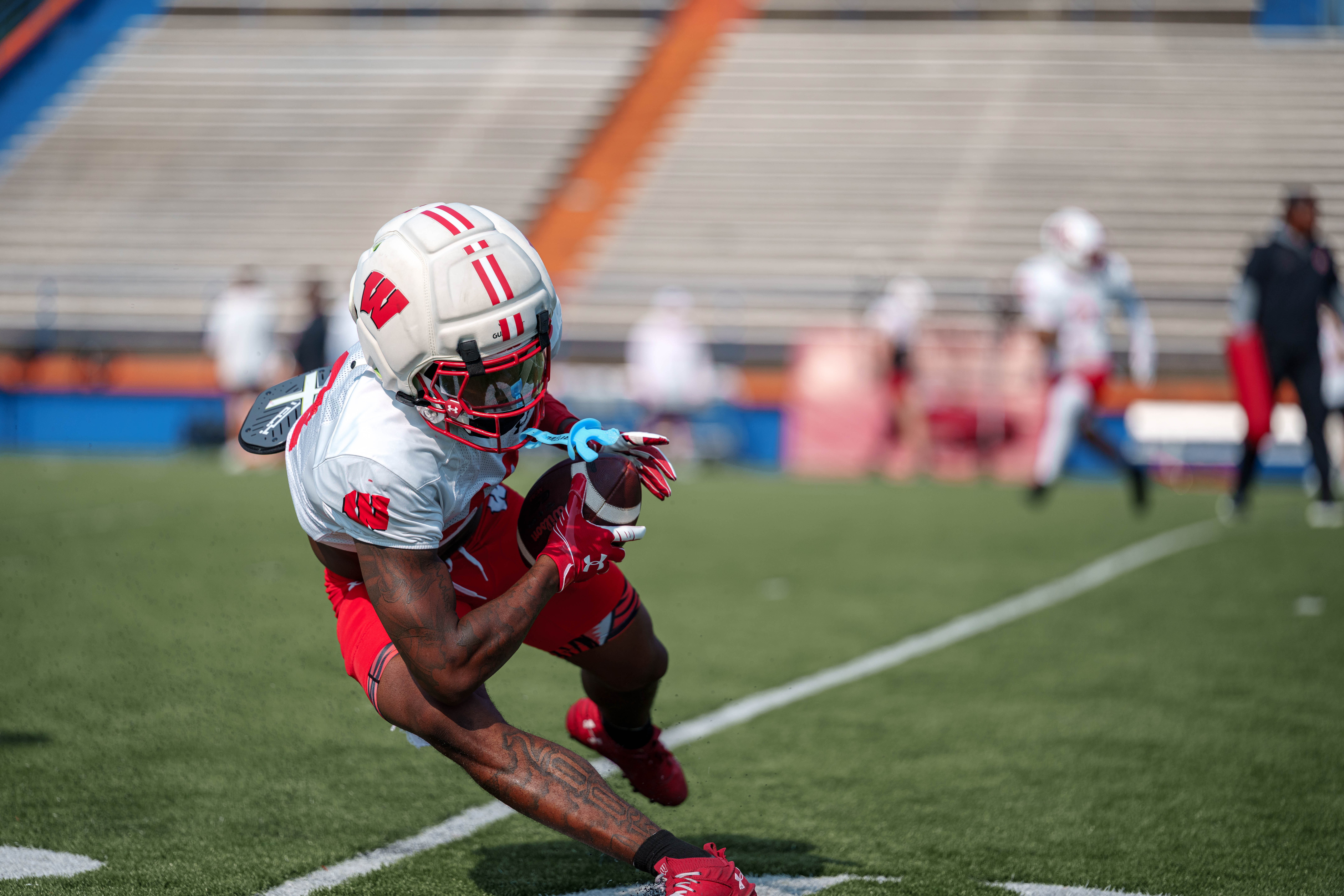 The Wisconsin Badgers football team during training camp at Ralph E. Davis Pioneer Stadium on August 03, 2025 in Platteville, Wisconsin. Photography by Ross Harried for Second Crop Sports.