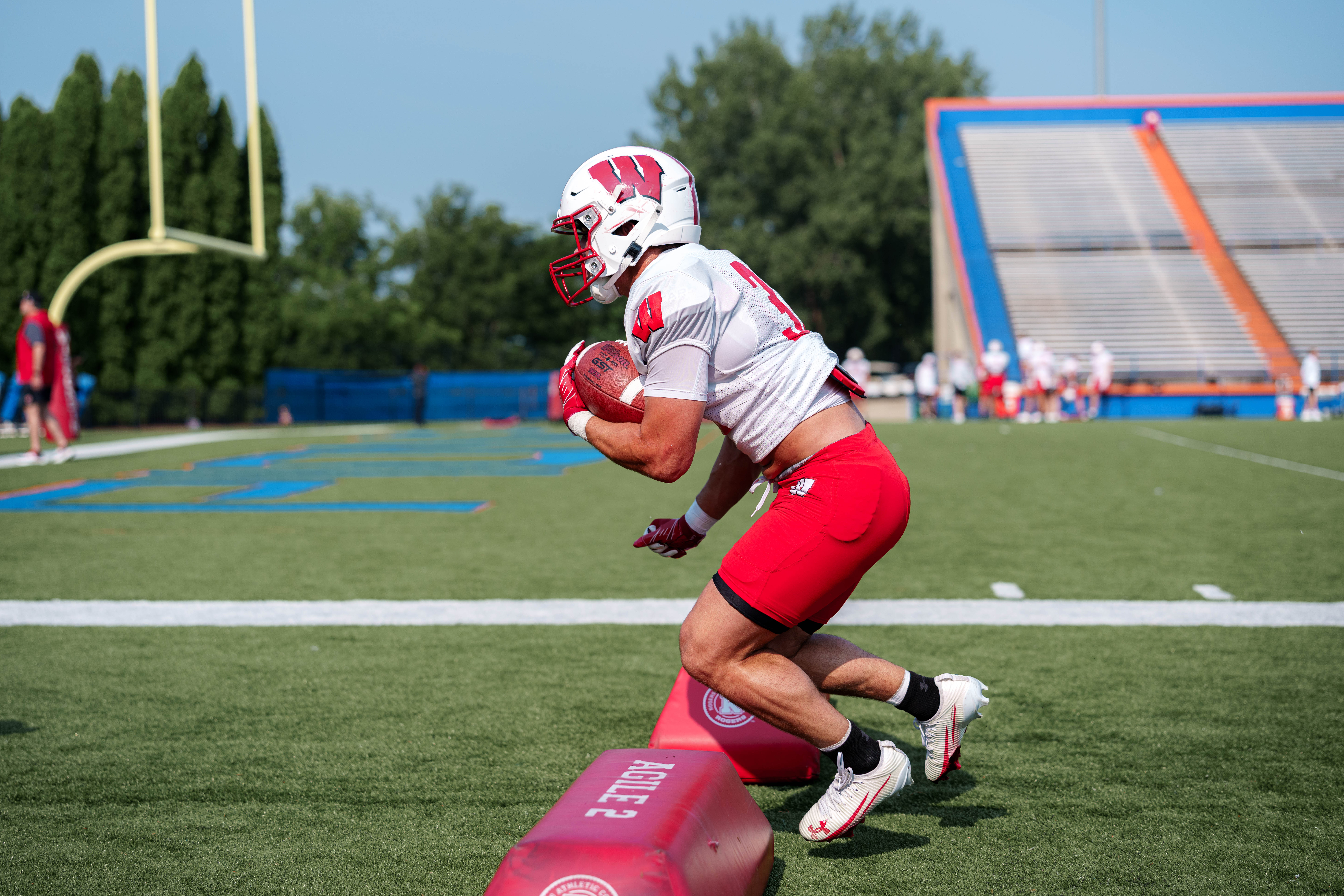 Wisconsin Badgers running back Harrison Bortolotti (32) runs a drill during training camp at Ralph E. Davis Pioneer Stadium on August 03, 2025 in Platteville, Wisconsin. Photography by Ross Harried for Second Crop Sports.