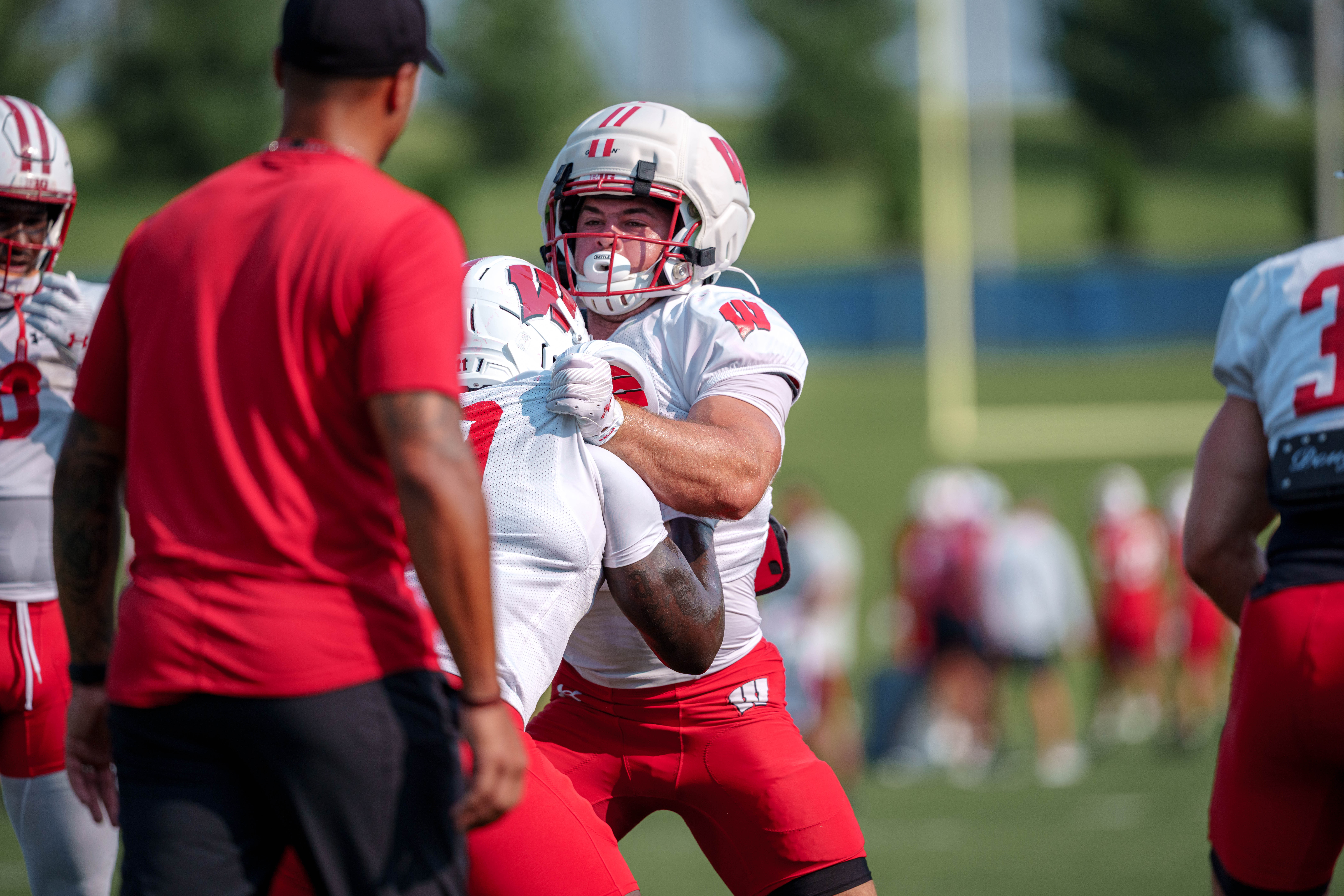 Wisconsin Badgers running back Cade Yacamelli (25) doing a blocking drill during training camp at Ralph E. Davis Pioneer Stadium on August 03, 2025 in Platteville, Wisconsin. Photography by Ross Harried for Second Crop Sports.