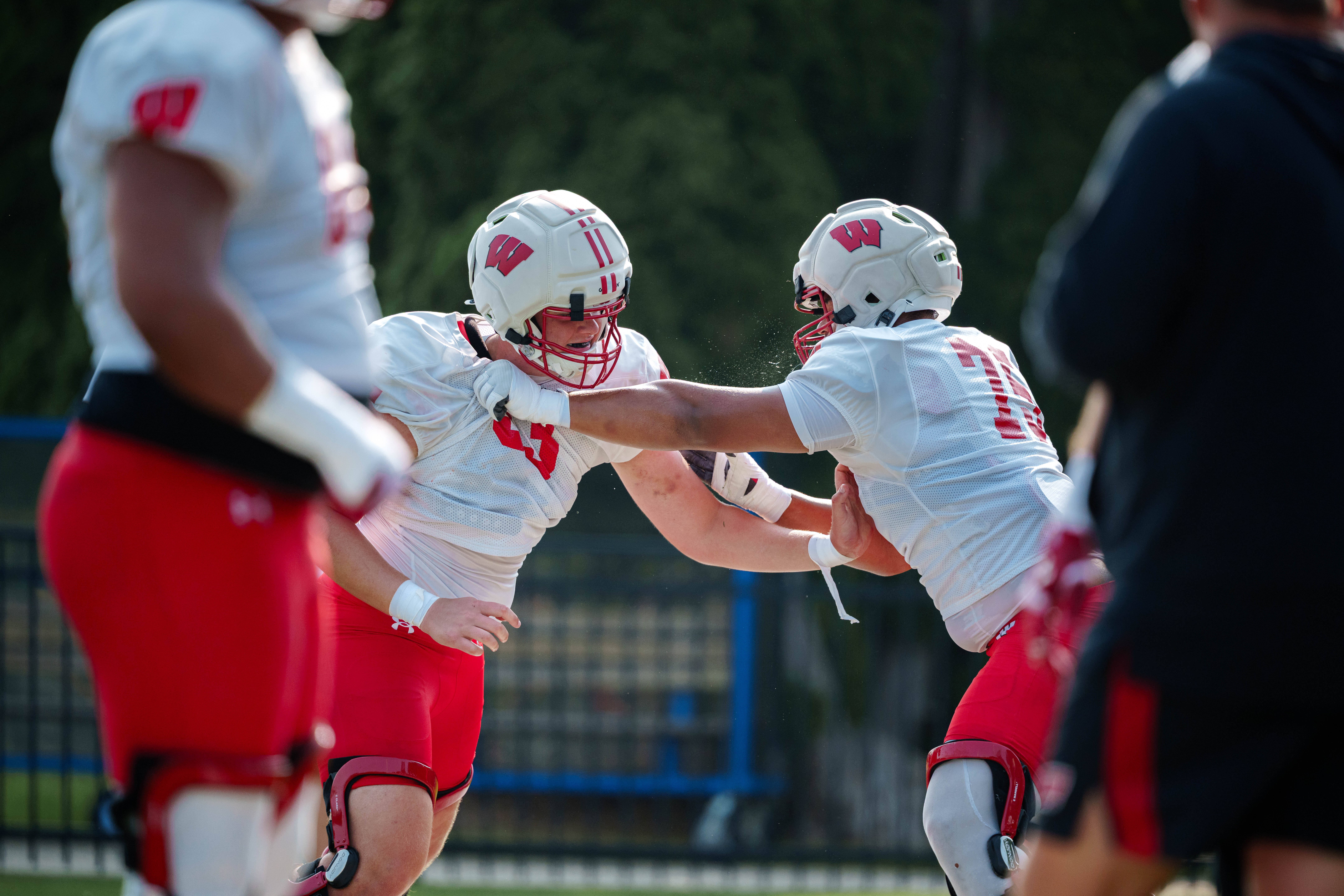 The Wisconsin Badgers offensive line does drills during training camp at Ralph E. Davis Pioneer Stadium on August 03, 2025 in Platteville, Wisconsin. Photography by Ross Harried for Second Crop Sports.