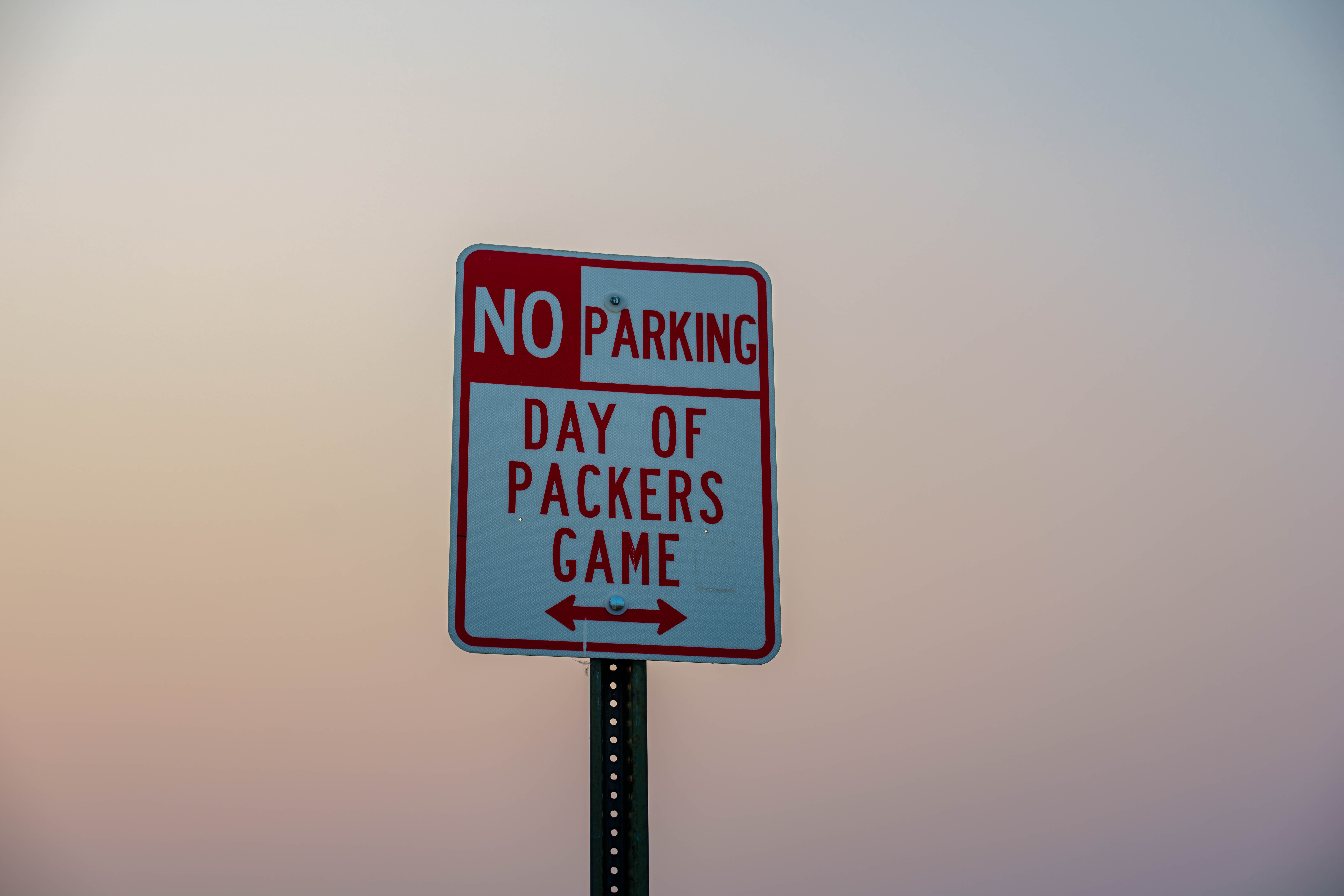 A “No Parking Day of Packers Game” sign is seen near Lambeau Field in Green Bay, Wisconsin, on August 6th, 2025. Photography by Ross Harried for Second Crop Sports.
