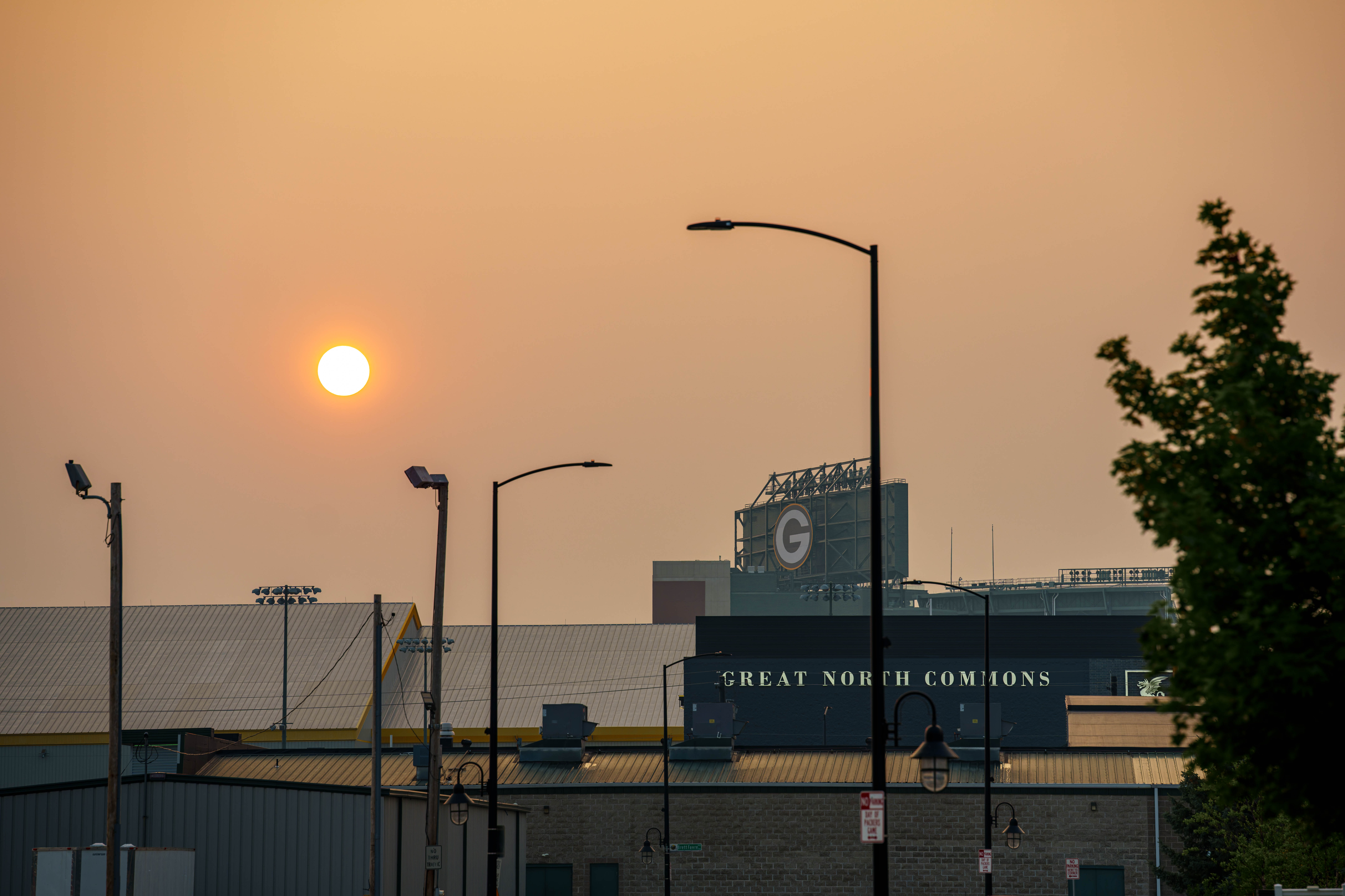 The sun sets over Lambeau Field during Green Bay Packers training camp in Green Bay, Wisconsin, on August 6th, 2025. Photography by Ross Harried for Second Crop Sports.