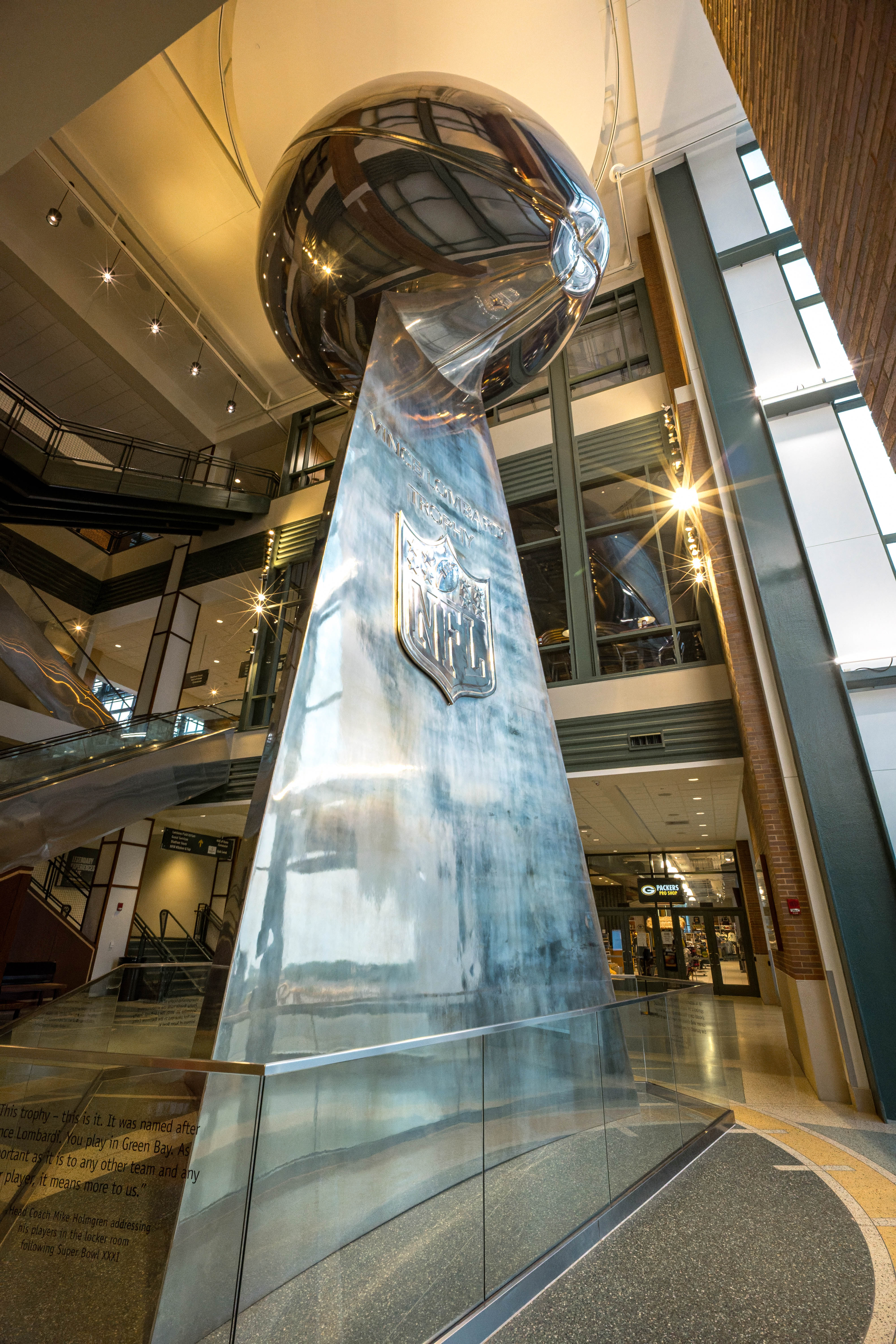 A large Lombardi Trophy replica is displayed inside Lambeau Field in Green Bay, Wisconsin, on August 6th, 2025. Photography by Ross Harried for Second Crop Sports.