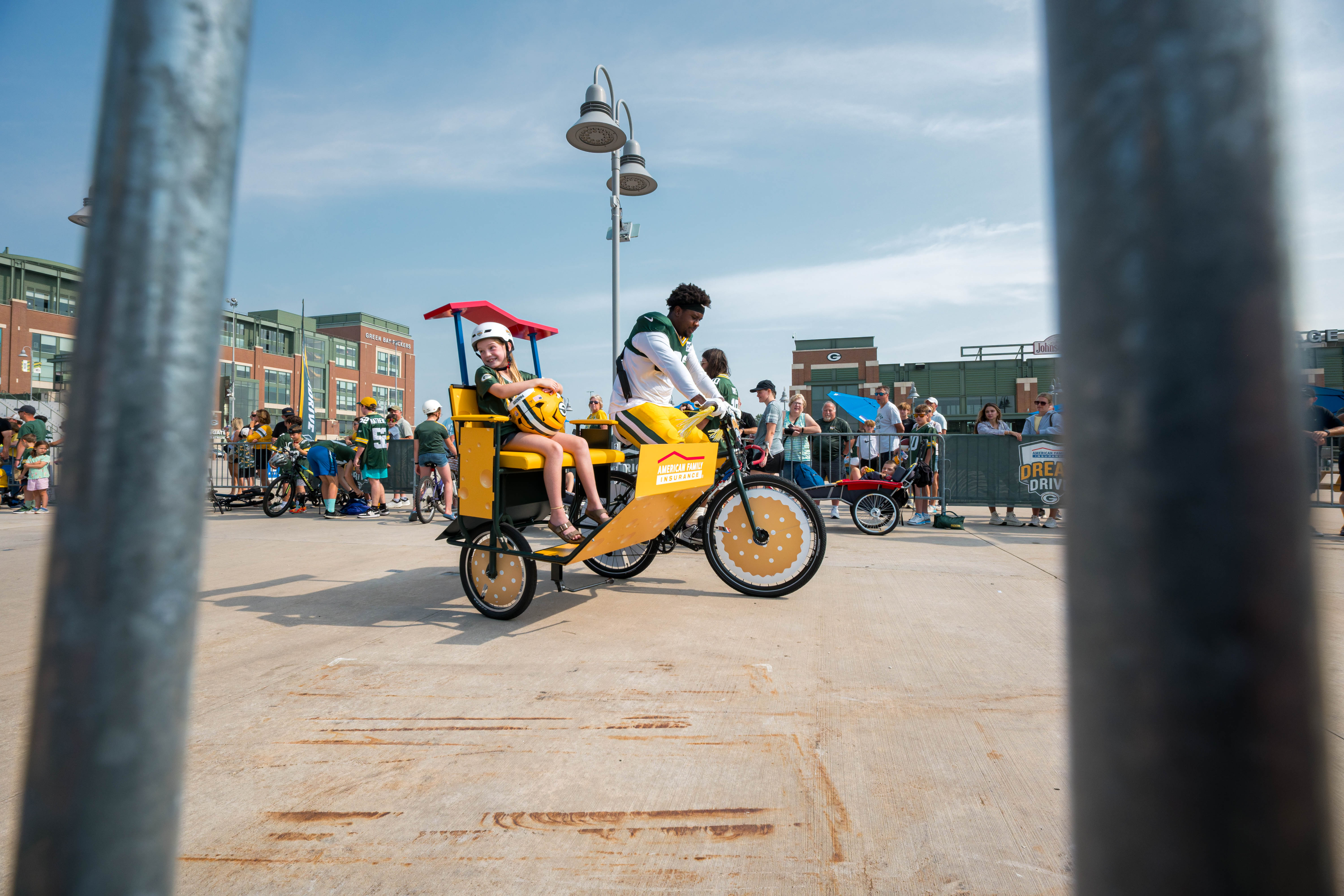 Green Bay Packers defensive lineman, Warren Brinson rides a bicycle to practice during the team’s DreamDrive tradition at training camp in Green Bay, Wisconsin, on August 6th, 2025. Photography by Ross Harried for Second Crop Sports.