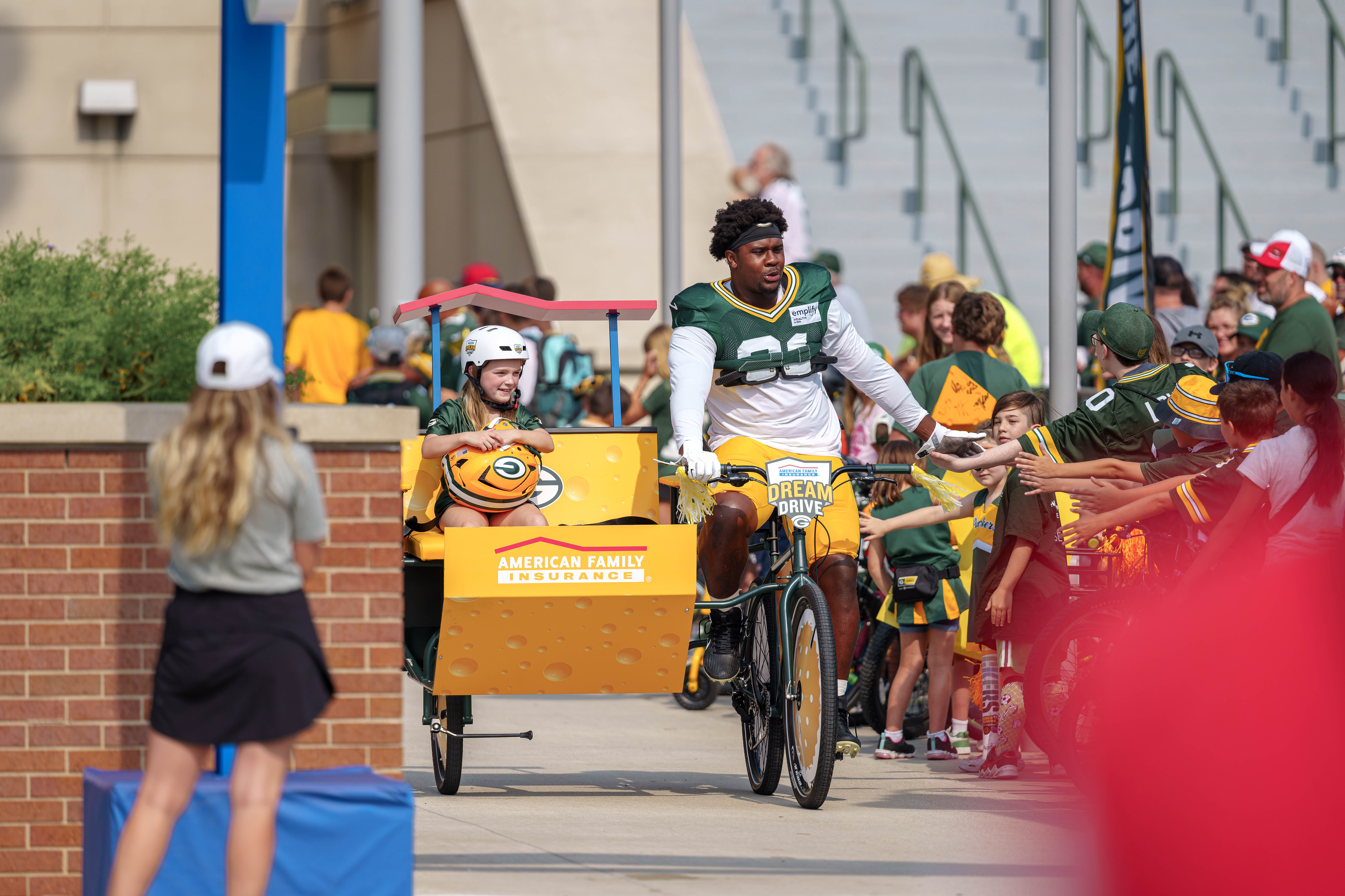 Green Bay Packers defensive lineman, Warren Brinson rides a bicycle to practice during the team’s DreamDrive tradition at training camp in Green Bay, Wisconsin, on August 6th, 2025. Photography by Ross Harried for Second Crop Sports.