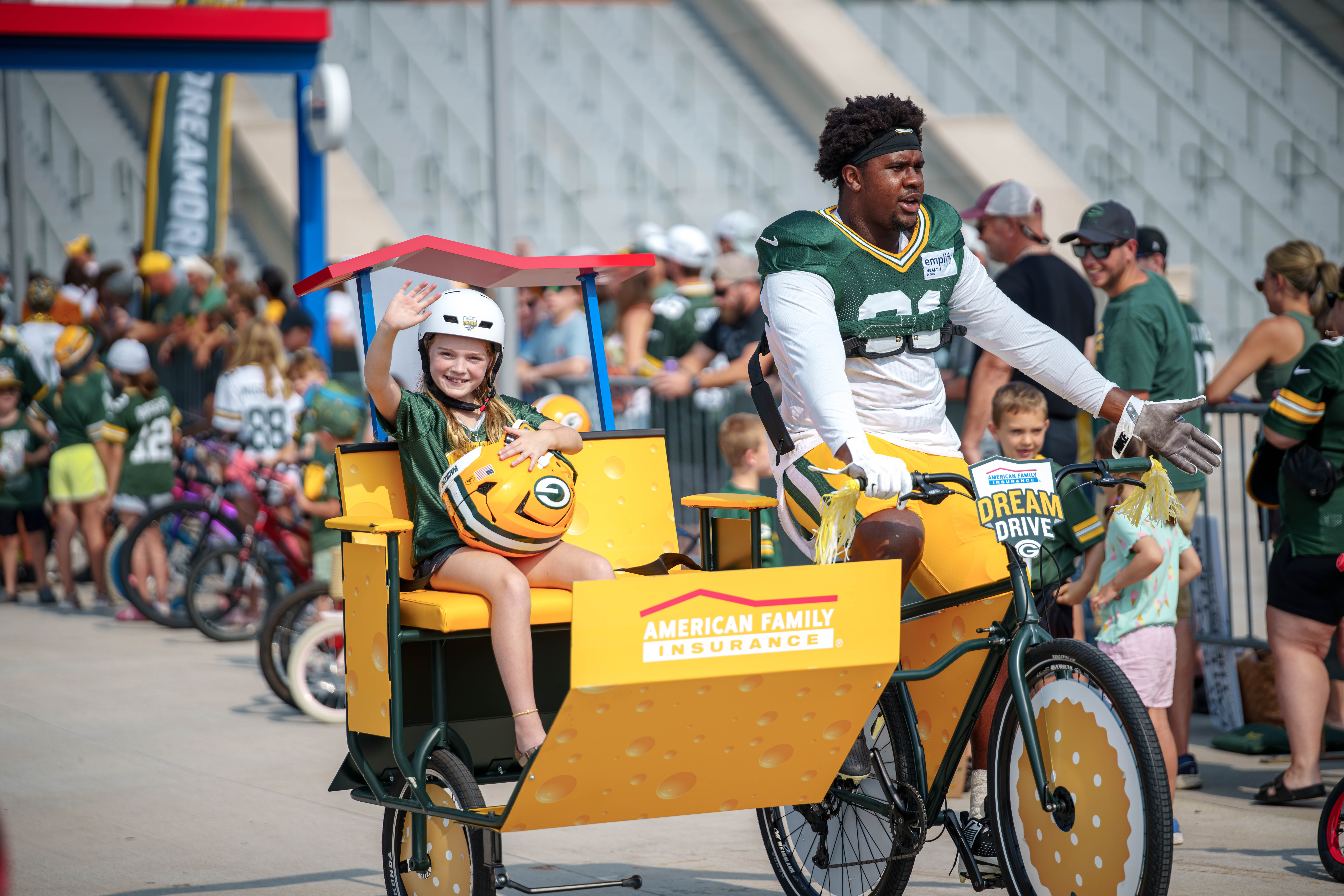 Green Bay Packers defensive lineman, Warren Brinson rides a bicycle to practice during the team’s DreamDrive tradition at training camp in Green Bay, Wisconsin, on August 6th, 2025. Photography by Ross Harried for Second Crop Sports.
