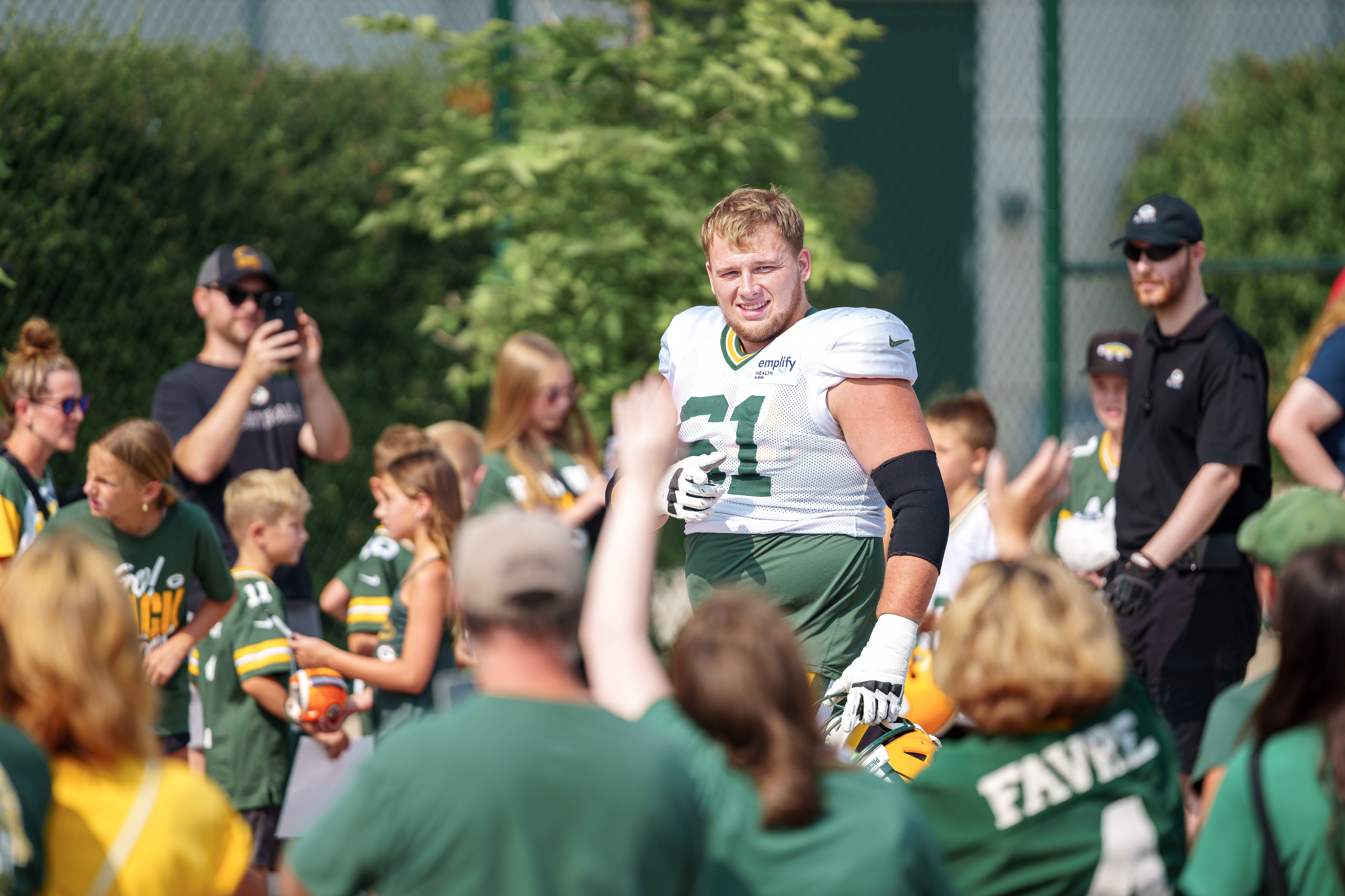 Green Bay Packers offensive lineman, J.J. Lippe recognizes someone in the crowd during training camp in Green Bay, Wisconsin, on August 6th, 2025. Photography by Ross Harried for Second Crop Sports.